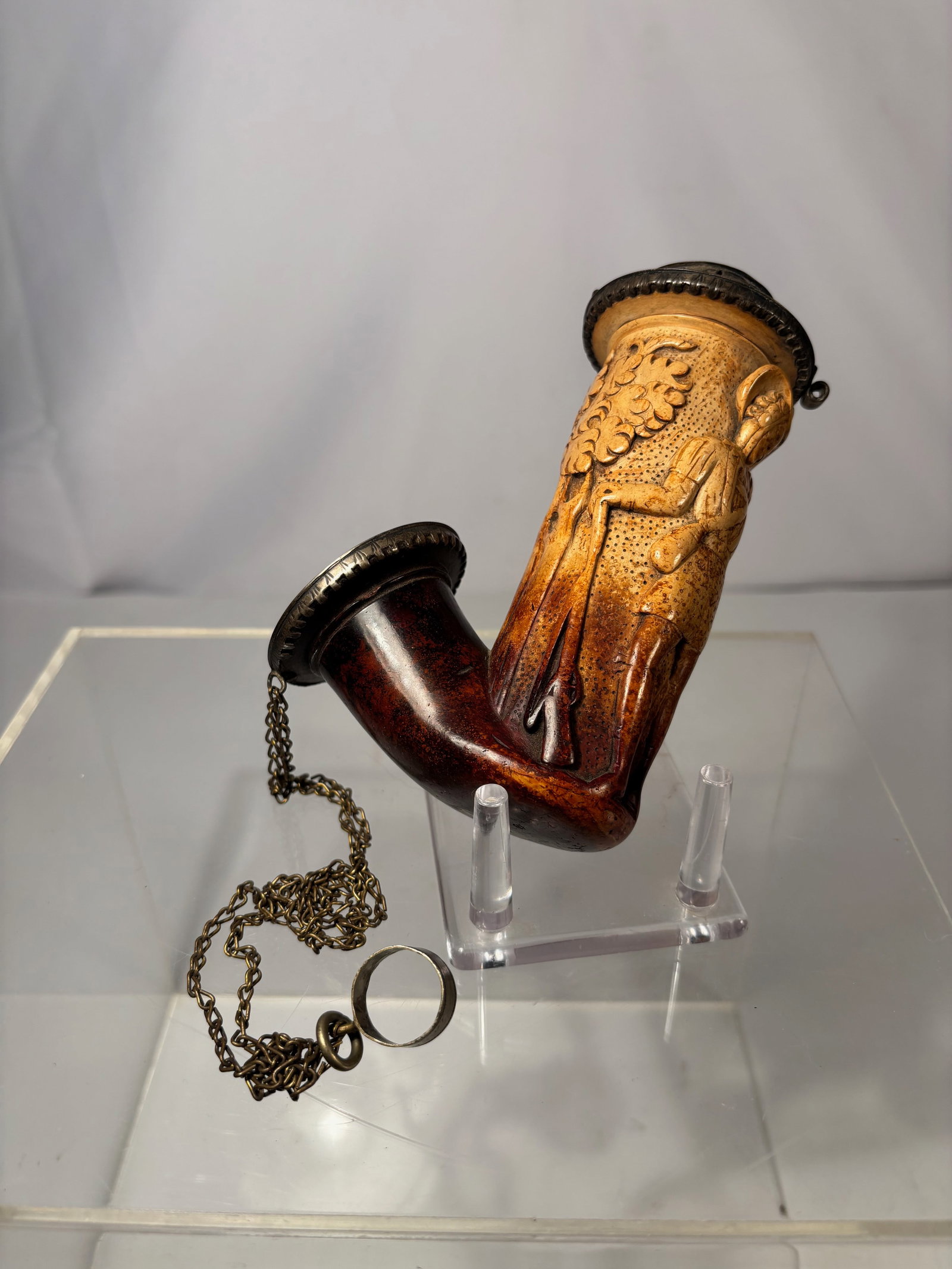 An Austrian Figural Meerschaum Pipe with Courting Couple, Silver-Mounted, 18th- 19th C.: Finely carved antique meerschaum tobacco pipe depicting a standing male and female figure in a romantic genre scene beneath foliate decoration. The bowl and shank are mounted with continental silver f