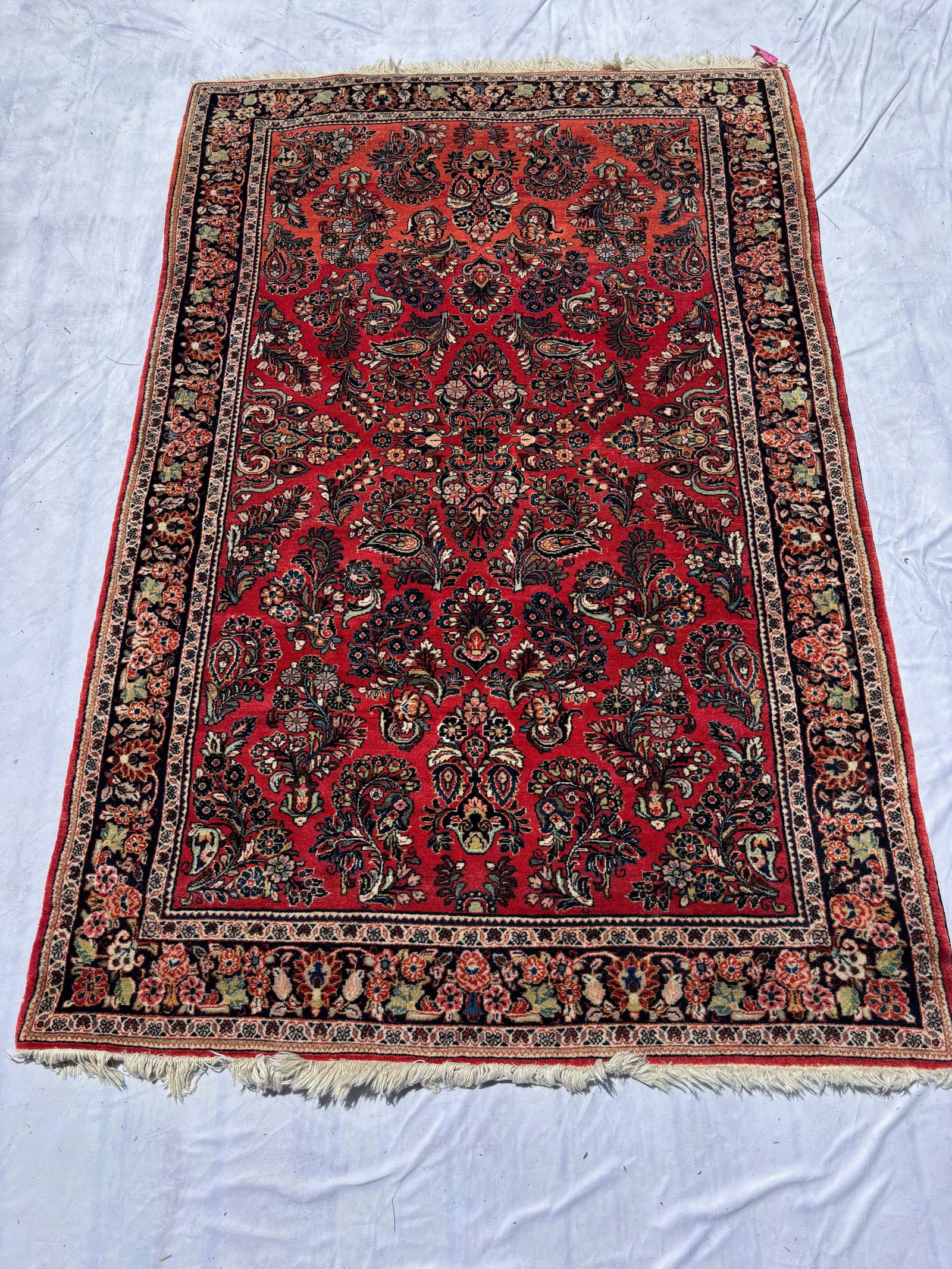Vintage Hand-Knotted Persian Style Floral Wool Rug. 77 x 49 in.: Hand-knotted wool rug featuring dense floral and boteh-inspired motifs on a deep red field within multiple floral borders. Traditional Persian design. Approx. 77 x 49 in. Inventory # 275007.
