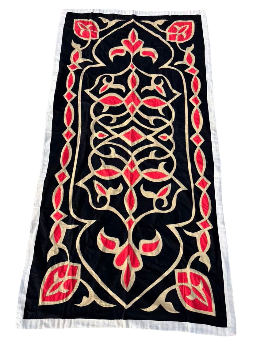 Vintage Egyptian Khayamiya Appliqué Textile, 35 × 68 in, Red and Ivory on Black: A hand-stitched Egyptian Khayamiya appliqué textile featuring intricate scrolling arabesque and foliate motifs in vivid red and ivory on a deep black cotton ground. Finely executed with symmetrical p