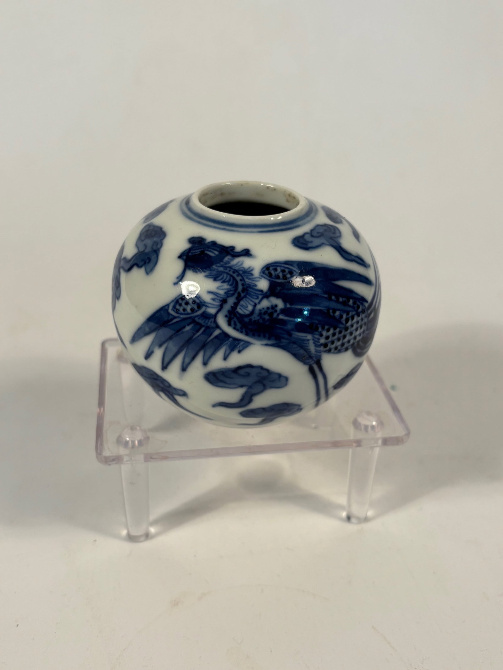 A Chinese Ming Dynasty blue and white porcelain waterpot with "JIAJING MARK": Jiajing period (1522–1566); Of compressed globular form with a short neck and small circular mouth, the body is decorated in rich underglaze cobalt blue with a five-clawed imperial dragon chasing a 