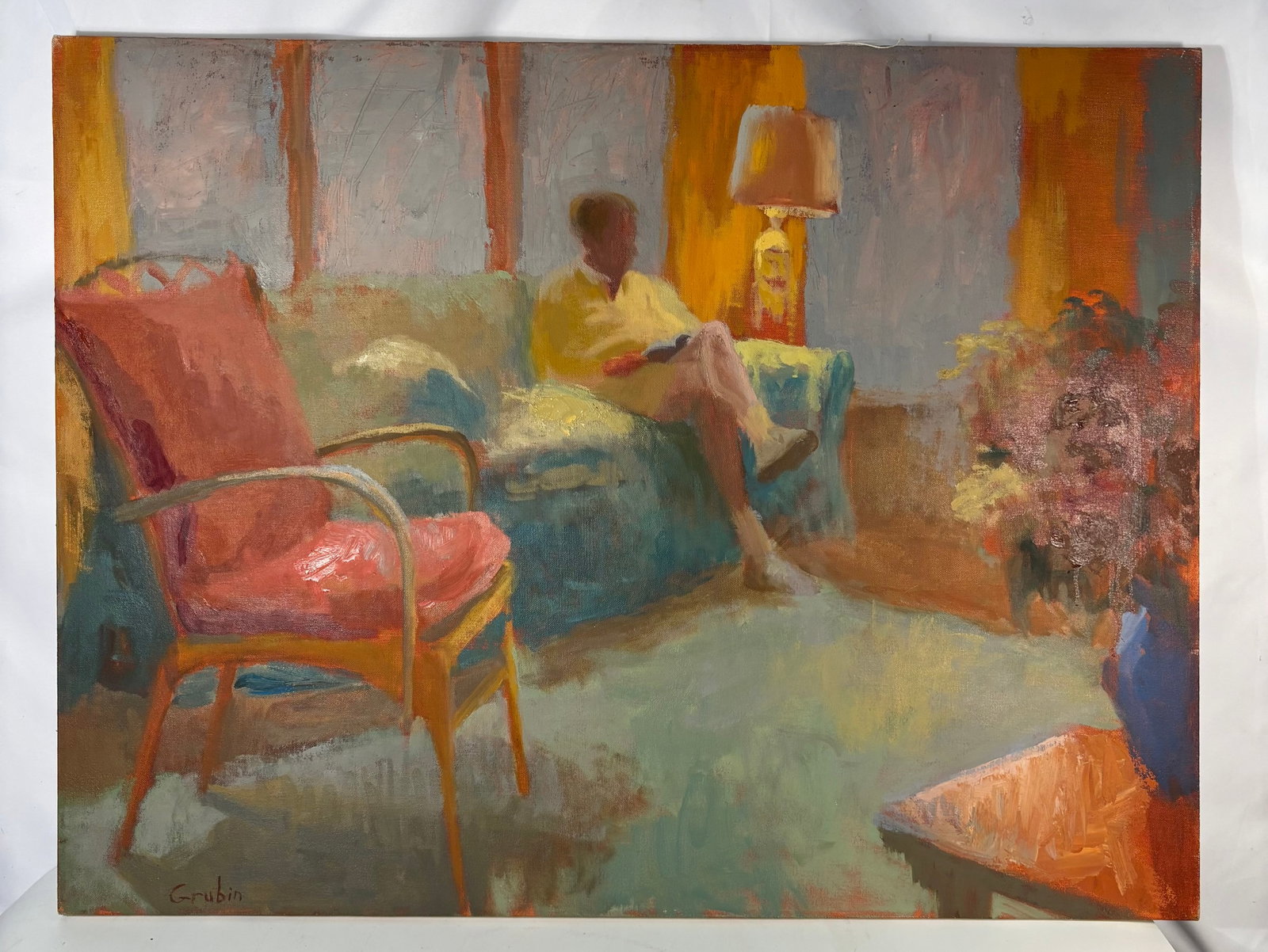 Signed Grubin 1995 Interior Figural Oil Painting: Signed lower left and dated 1995 on the reverse, this atmospheric interior painting depicts a seated female figure in a softly lit domestic setting. The composition features a vivid pink chair in the 