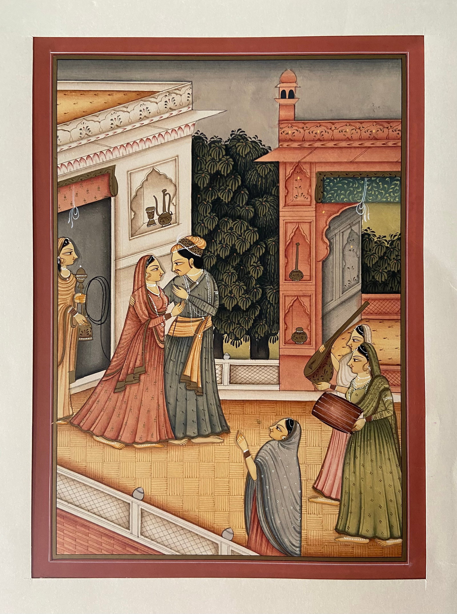 Indian Gouache Miniature–Royal Couple with Attendants, Rajasthan/Mughal School: 19th century; Opaque watercolor heightened with gold on paper, depicting a finely dressed royal couple in an intimate moment within a palace courtyard, surrounded by attendants and musicians. The figu