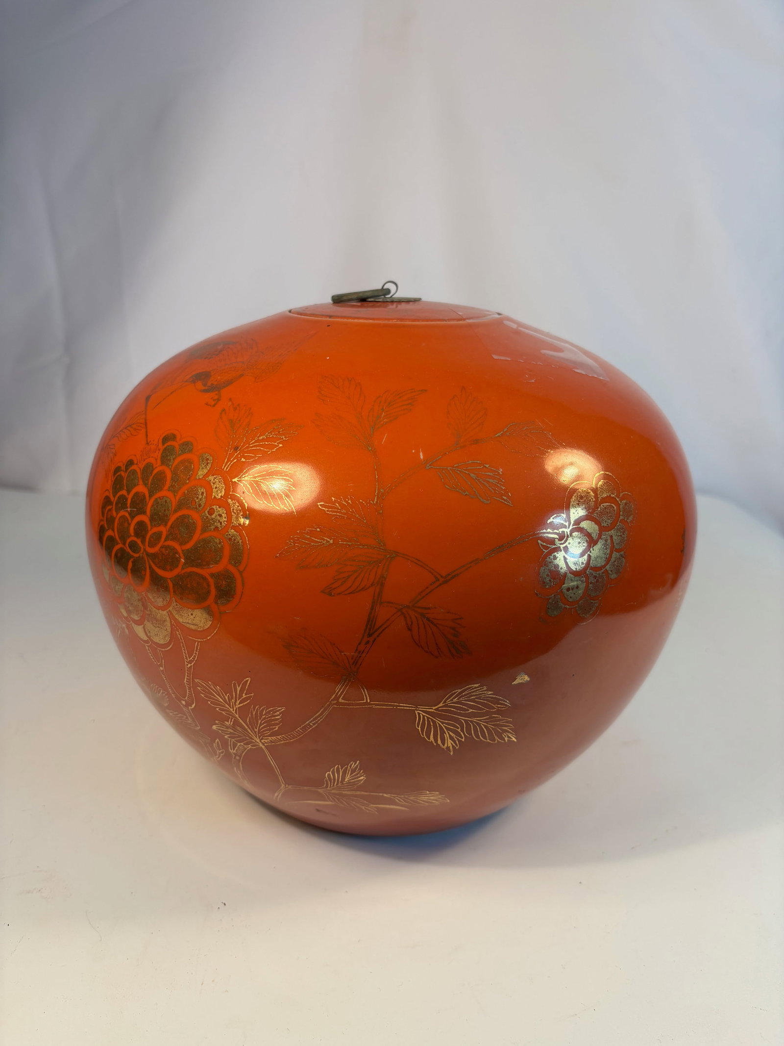 Chinese Coral-Red Ground Porcelain Jar with Gilt Calligraphy with Mark: Qing Dynasty(1644-1912); Of rounded compressed form with a fitted metal cover, the exterior finely enameled in a rich coral-red ground and decorated with gilt poetic inscriptions and floral sprays. Th