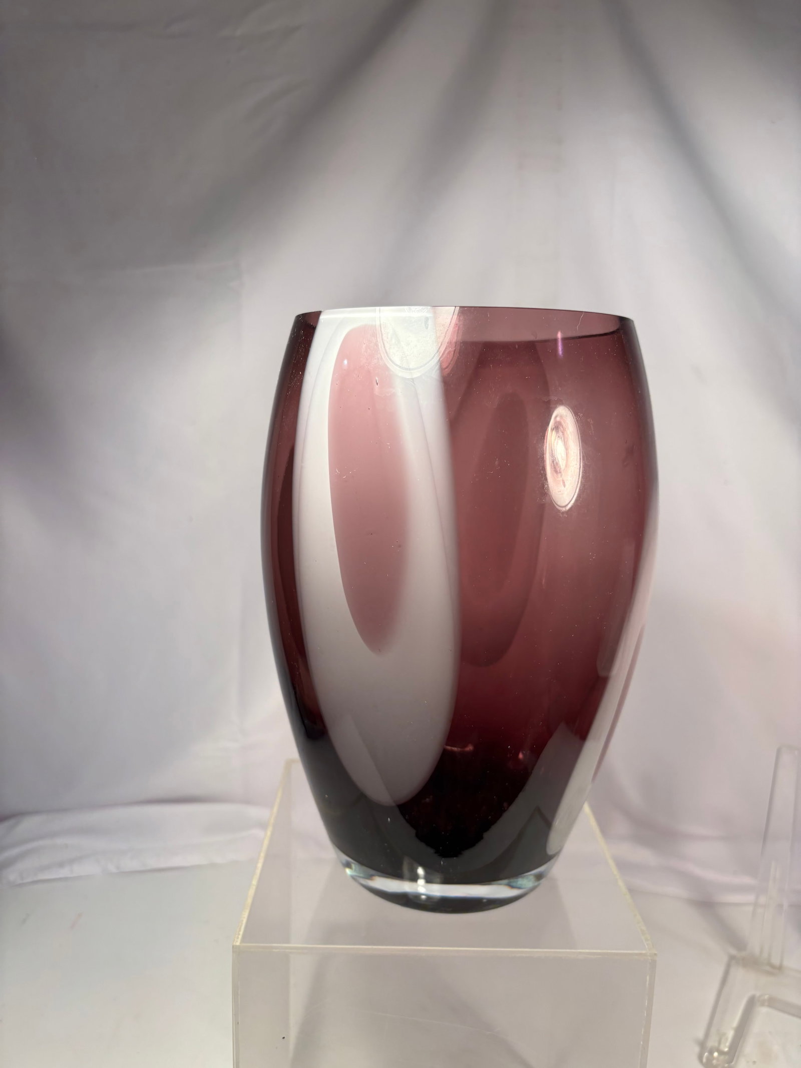 Vintage Hand Blown Amethyst Art Glass Vase: A beautiful hand-blown art glass vase featuring a rich amethyst purple hue with a thick clear glass base. The elegant rounded form and substantial weight showcase the quality of the handcrafted glassw