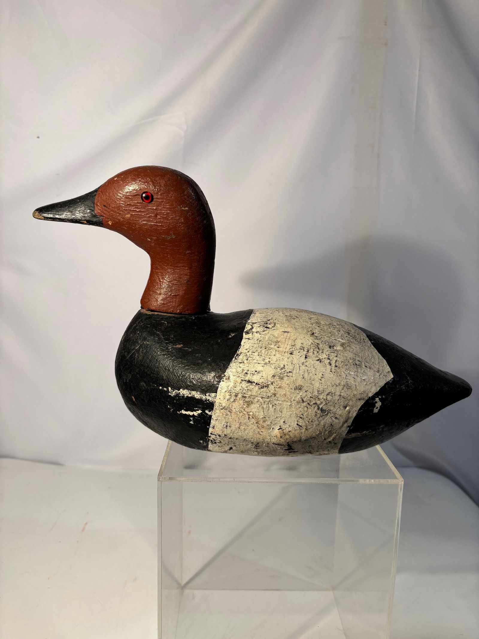 American weighted Folk Art Duck Decoy, Oneida Lake NY: Hand-carved American weighted duck decoy, reportedly from Oneida Lake, New York. Featuring a red-brown carved head with painted black body and textured white breast. The underside bears an old handwri