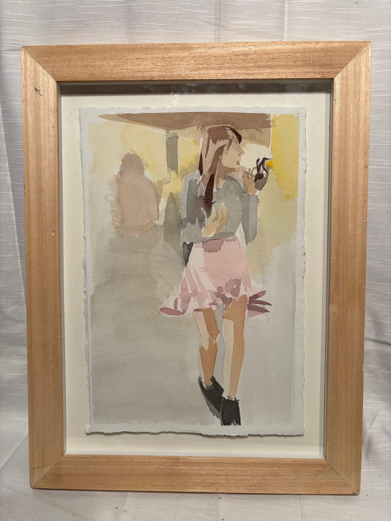 Contemporary Figurative Watercolor Painting, , Framed: A contemporary watercolor-style composition depicting a young woman in motion, rendered with loose, expressive brushwork and a soft, muted palette. The figure, dressed in a pink skirt and neutral-tone