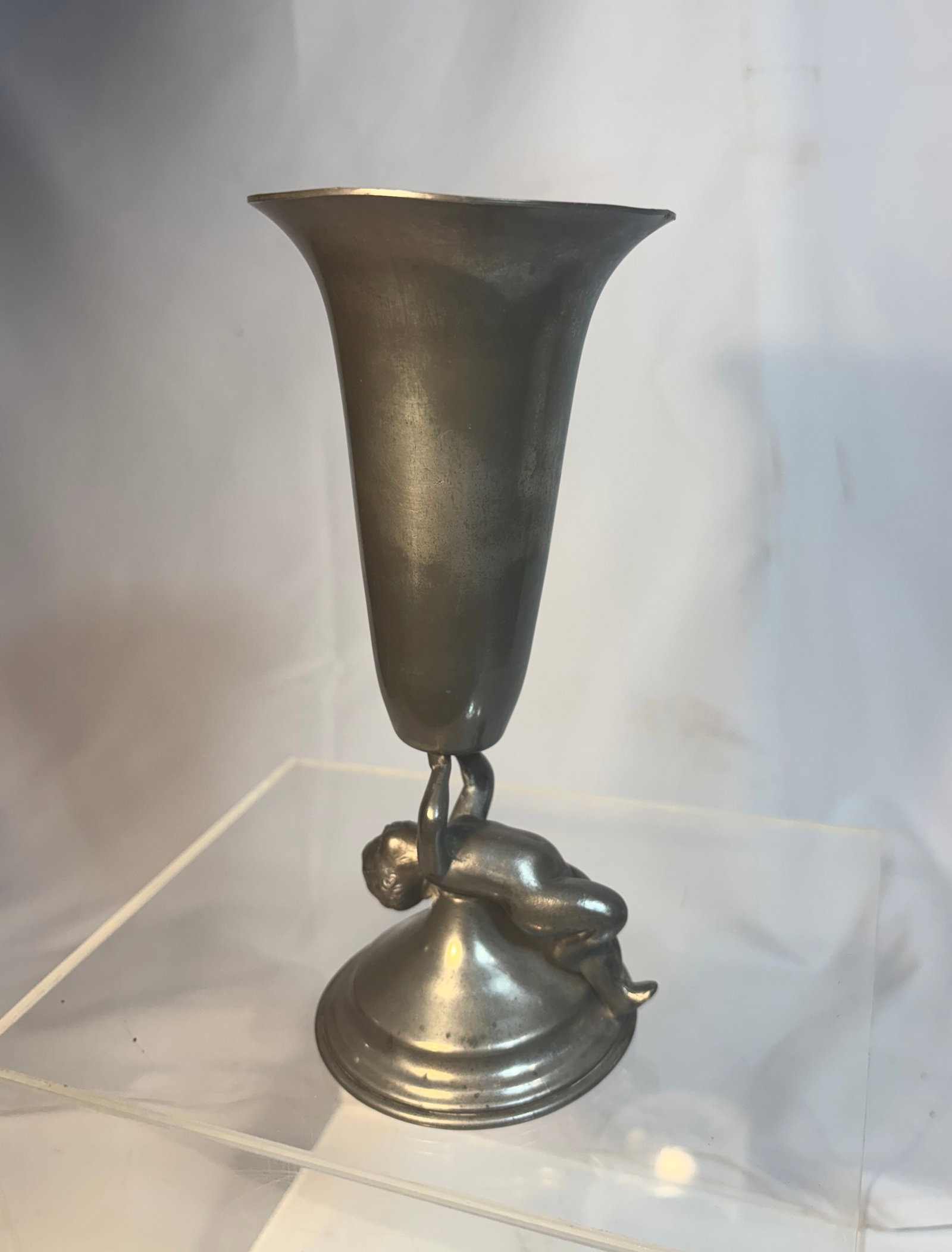 Art Deco Style Nude Figure Pewter Vase / Compote: An Art Deco style pewter or spelter vase featuring a sculptural nude female figure supporting a flared trumpet-form vessel above a circular pedestal base. Executed in a streamlined modernist manner wi