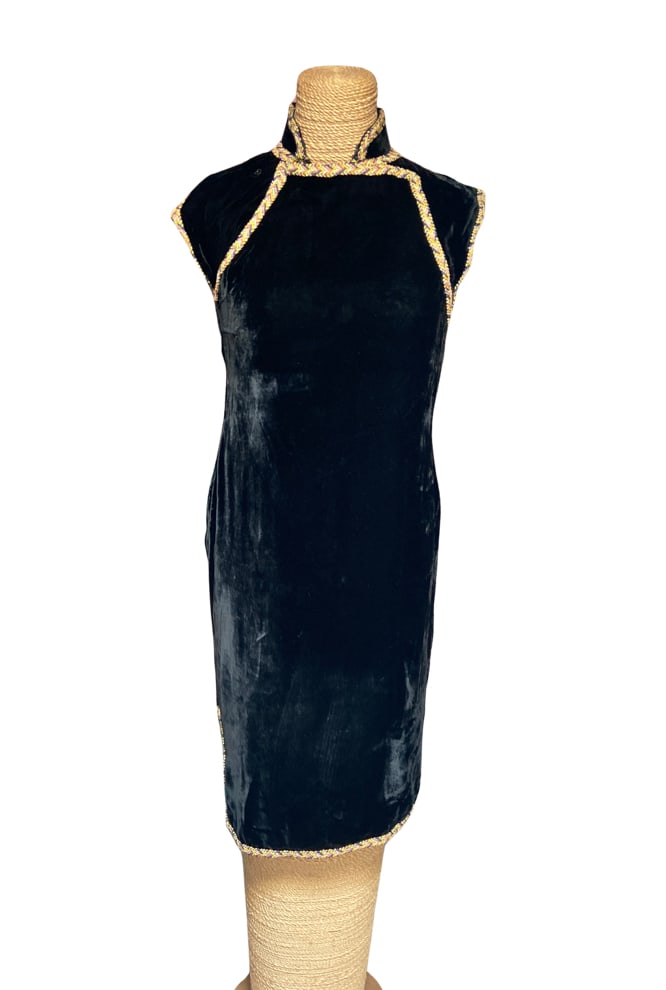 Vintage Black Velvet Chinese Cheongsam (Qipao) Dress with Multicolor Braided Trim: Elegant vintage Chinese-style qipao (cheongsam) crafted in rich black velvet. Features a traditional Mandarin collar, cap sleeves, colorful braided trim along the collar, front closure, sleeves, hem, 