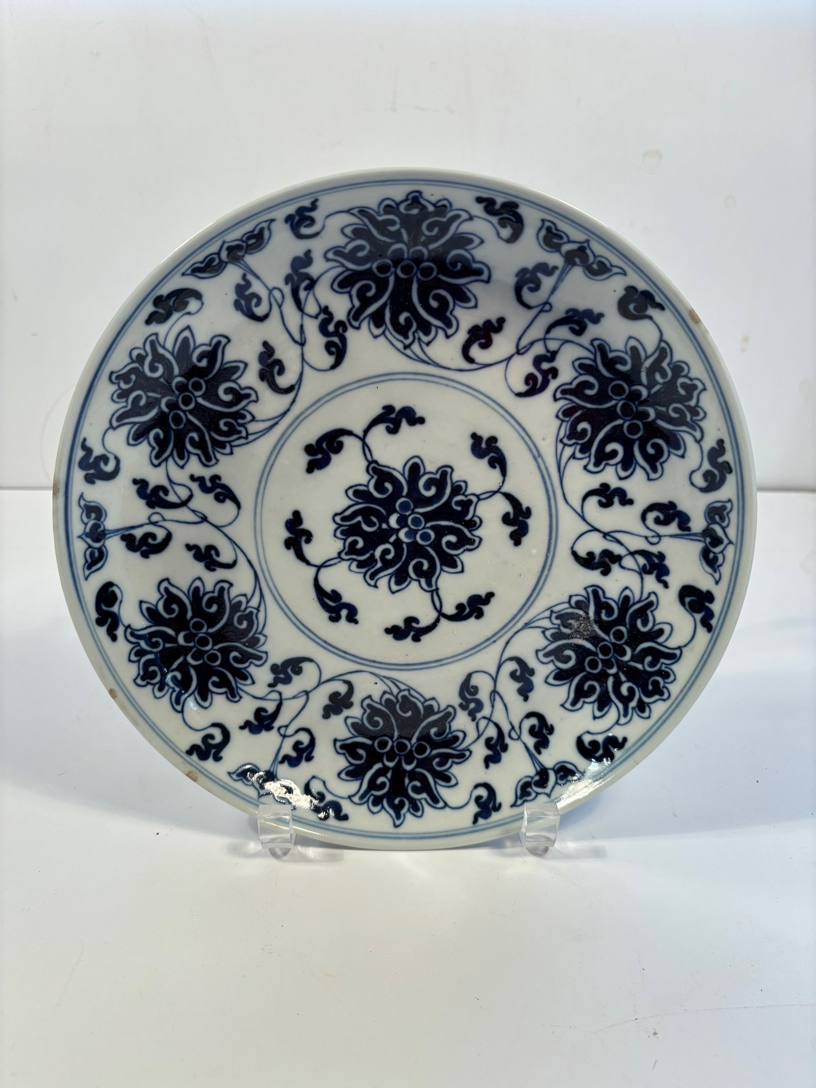 A Chinese blue and white porcelain plate with "GUANGXU"six character: Qing Dynasty (1644-1912), Marked:“Made in the Guangxu period of the Great Qing (Dynasty)”Dimensions? Diameter: 9.5 inches ; Height : 1.3 inches.