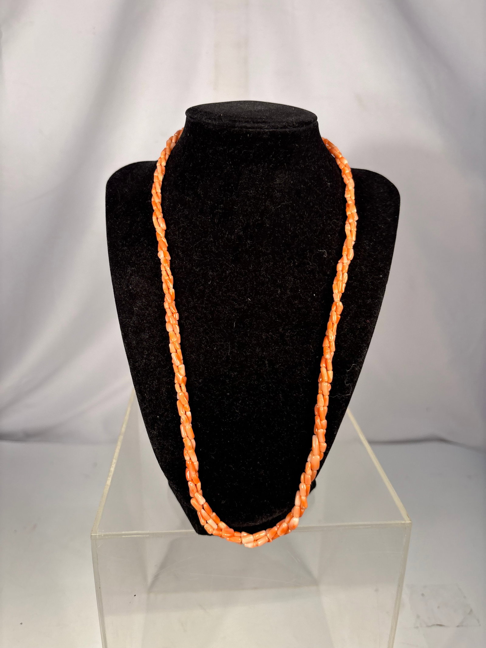 Vintage Natural Mediterranean Salmon Pink Coral Multi-Strand Branch Bead Necklace: Vintage necklace featuring multiple strands of natural Mediterranean salmon pink coral branch beads. The necklace is hand-strung with organically shaped polished coral beads displaying attractive natu