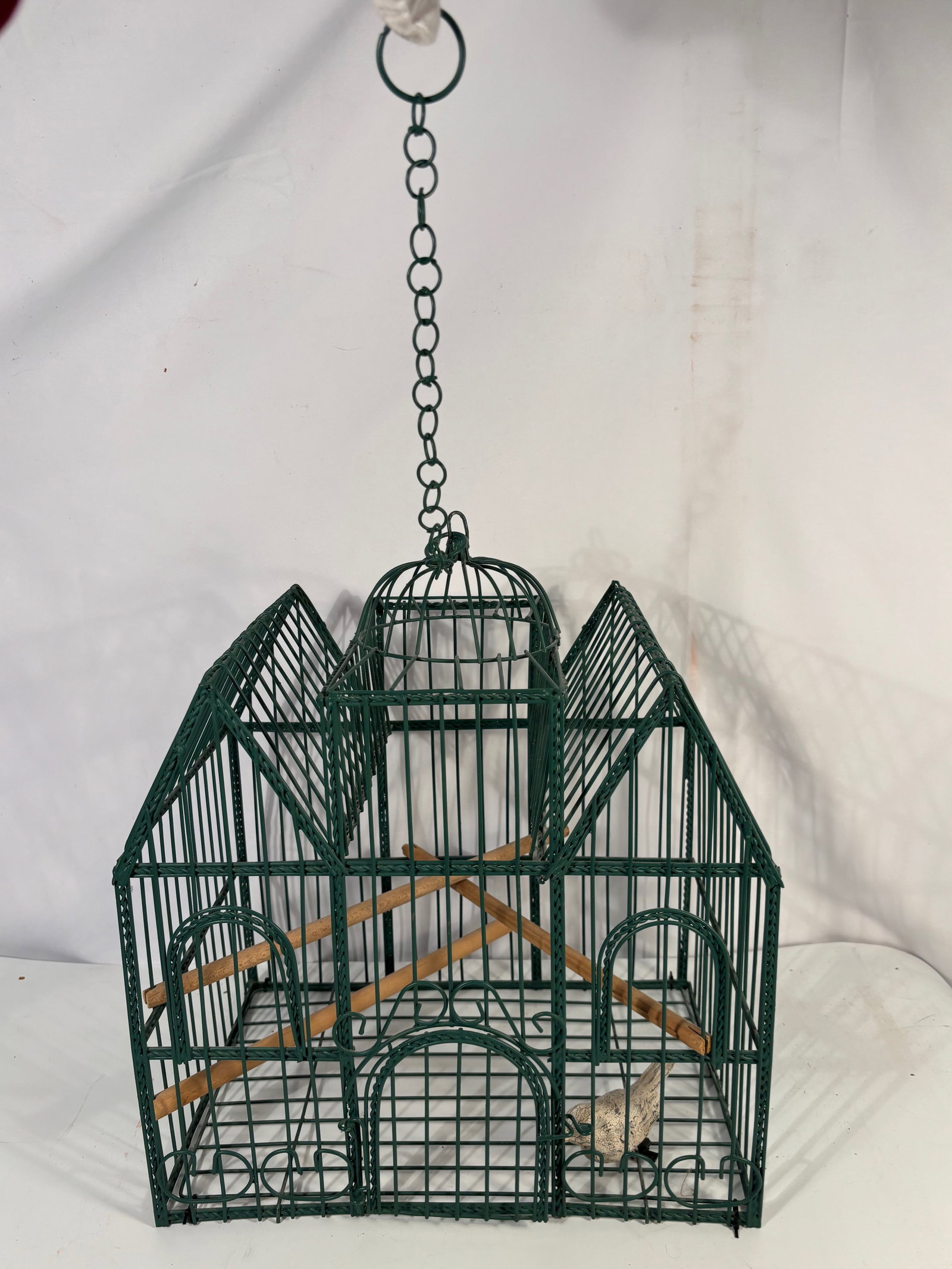 Vintage Painted Metal Decorative Bird Cage: Painted metal decorative bird cage with domed top and geometric architectural form. Featuring wood perches and hanging chain. size: Height: 12 inches without chain.