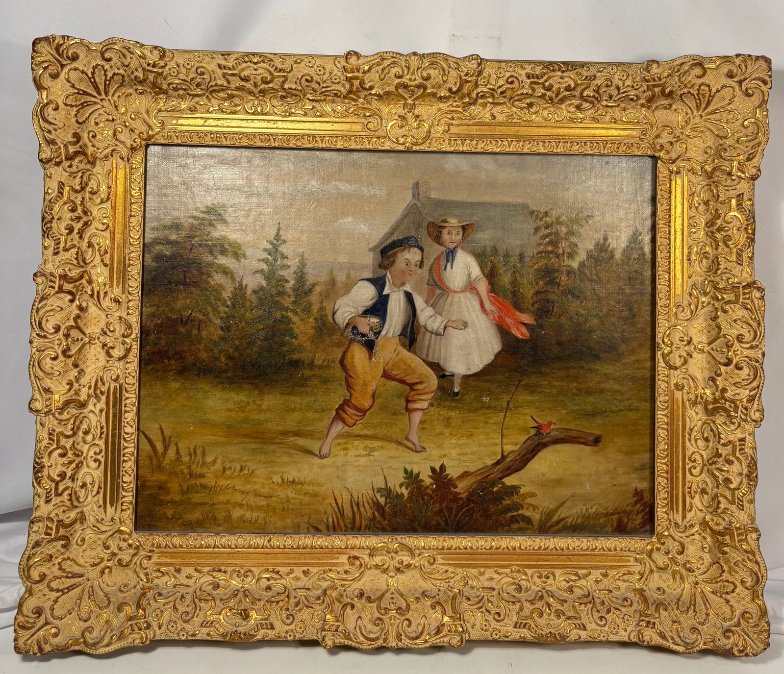 19th Century European Genre Oil Painting of Children in a Landscape: A 19th-century European genre oil painting on canvas depicting two children in a tranquil rural landscape. The composition features a barefoot boy in traditional country attire playfully approaching a