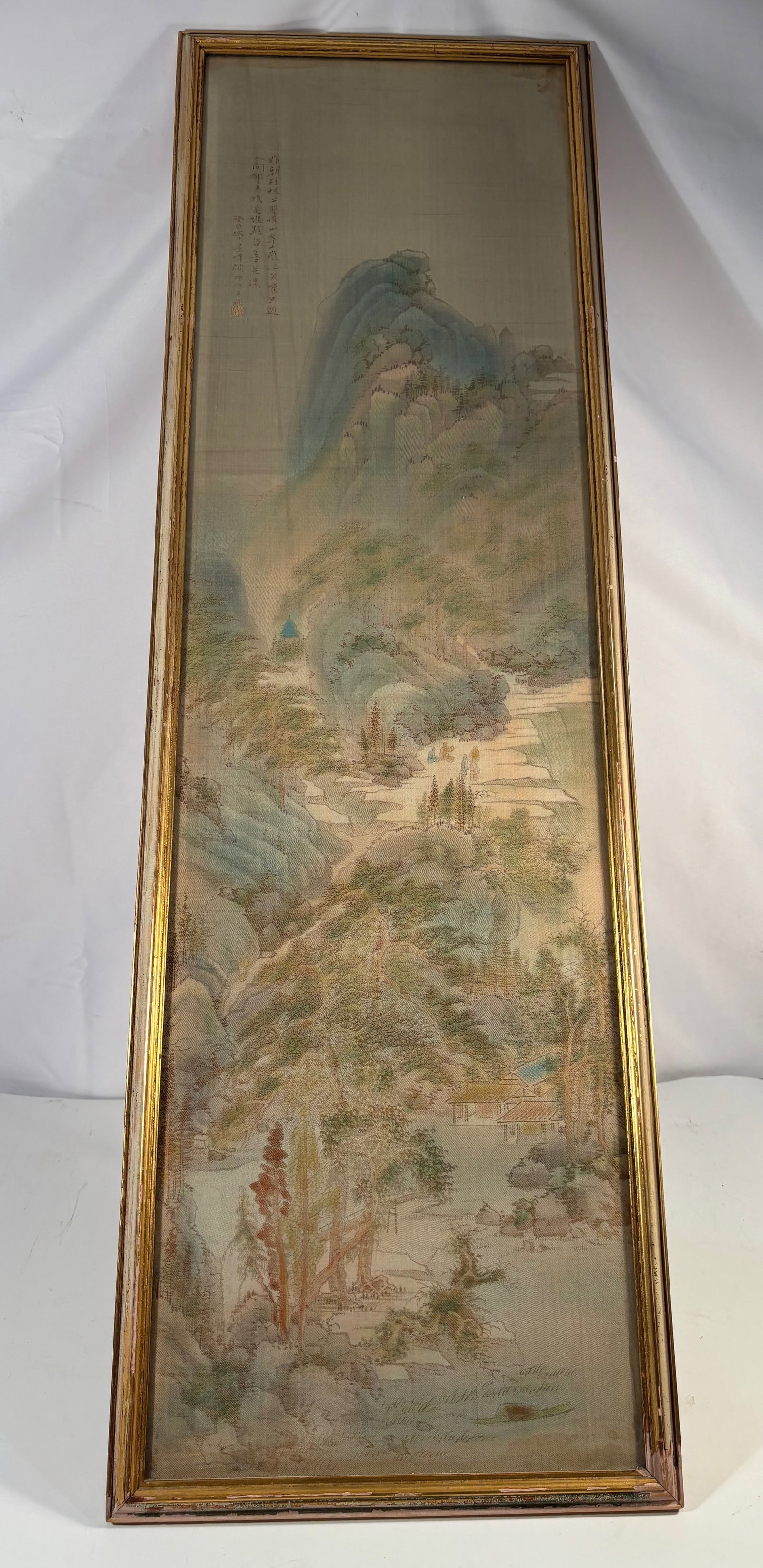 Chinese Silk Embroidery Landscape with Scholars and Inscription Signed Gu Kun: Qing dynasty(1644-1912); Finely worked silk embroidery depicting a scholar’s retreat within a lush mountain landscape. Several robed figures are shown conversing beneath tall pines and rocky cliffs,
