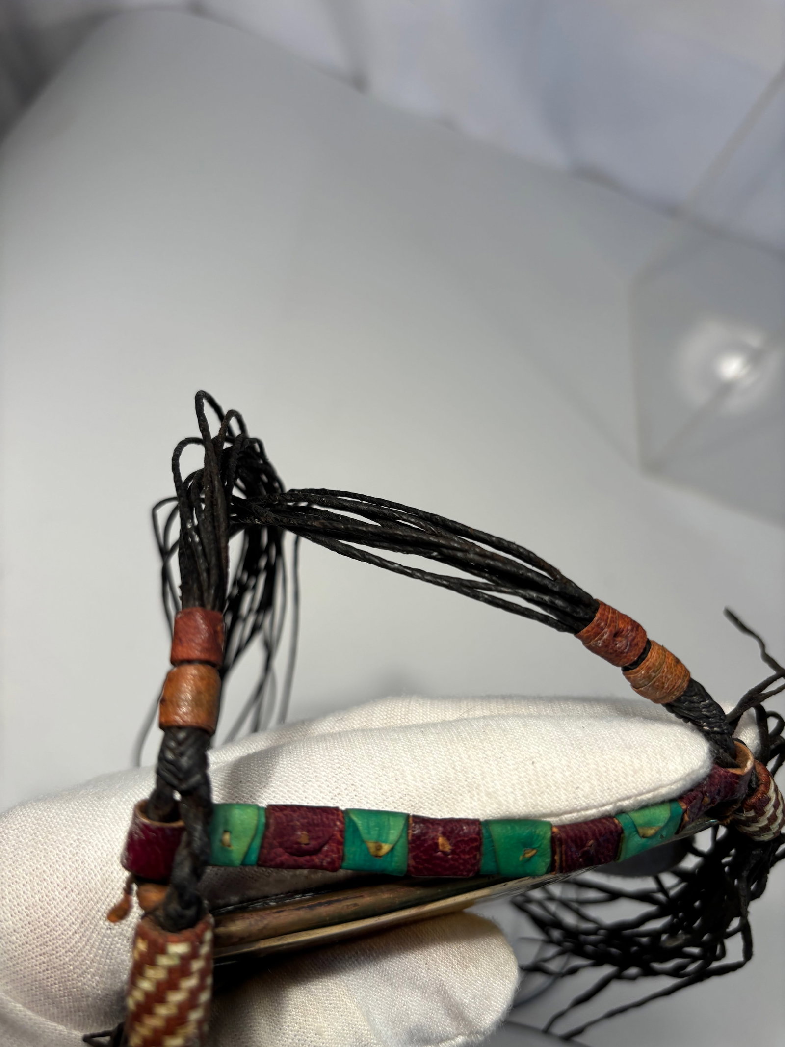 Tuareg Tcherot Gris-Gris Amulet Pendant, Engraved Brass with Beadwork, Africa, Early 20th Century: An old Tuareg Tcherot (also called Gris-Gris) amulet pendant, traditionally worn for protection and spiritual power. The piece is handcrafted from engraved brass with geometric designs typical of Saha