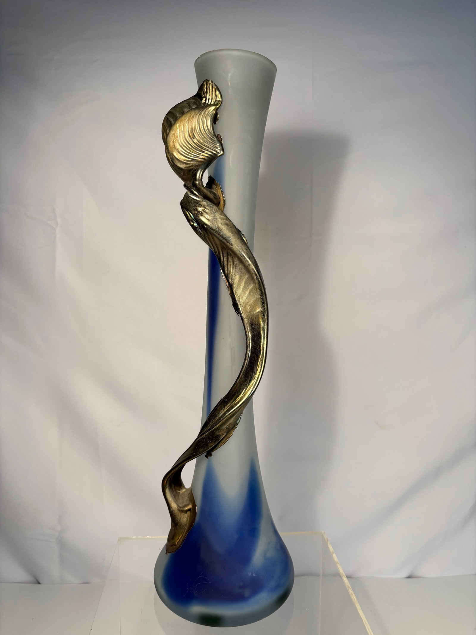 FILIP RAVERT ART GLASS VASE WITH BRONZE OVERLAY: This is a beautiful Filip Ravert Blue Art Glass Swirl Vase with Bronze Overlay. Dimensions?Height: 18 inches