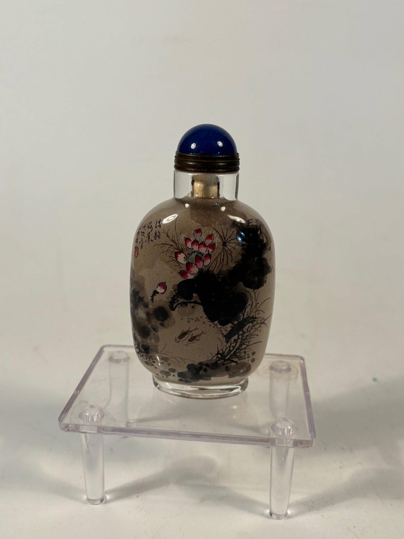 A Chinese inside-painted glass snuff bottle signed" ER ZHONG": A finely executed Chinese inside-painted (interior-painted) glass snuff bottle, signed Er Zhong (??); The reverse features Chinese calligraphy ,Lotus flowers, fish, calligraphy inscription, and artist