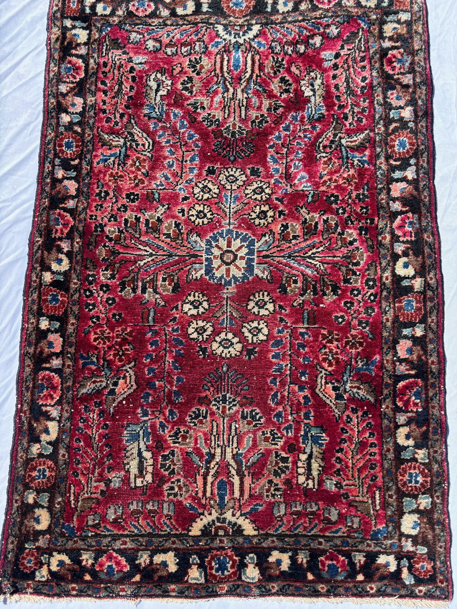 Antique Persian Hamadan Style Hand Knotted Wool Rug, 48 x 31 in.: A Persian Hamadan style hand knotted wool rug featuring an intricate allover floral and geometric design on a rich crimson field with contrasting floral borders. Exhibiting traditional village weaving