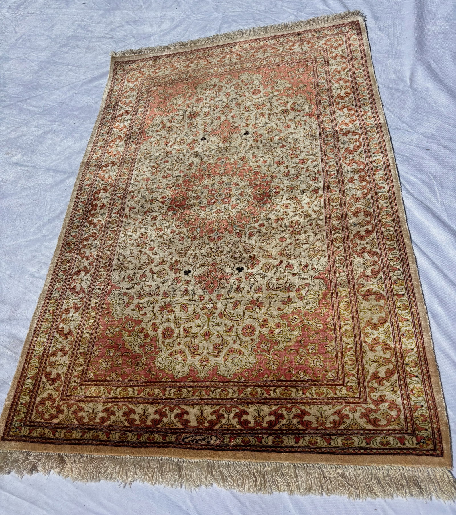 Fine Persian Qom Style Silk Floral Rug 48 x 30 in.: Fine Persian Qom style rug featuring an intricate floral medallion and scrolling vine design on an ivory and salmon field with elaborate borders. Likely silk or silk-blend construction with finely wov