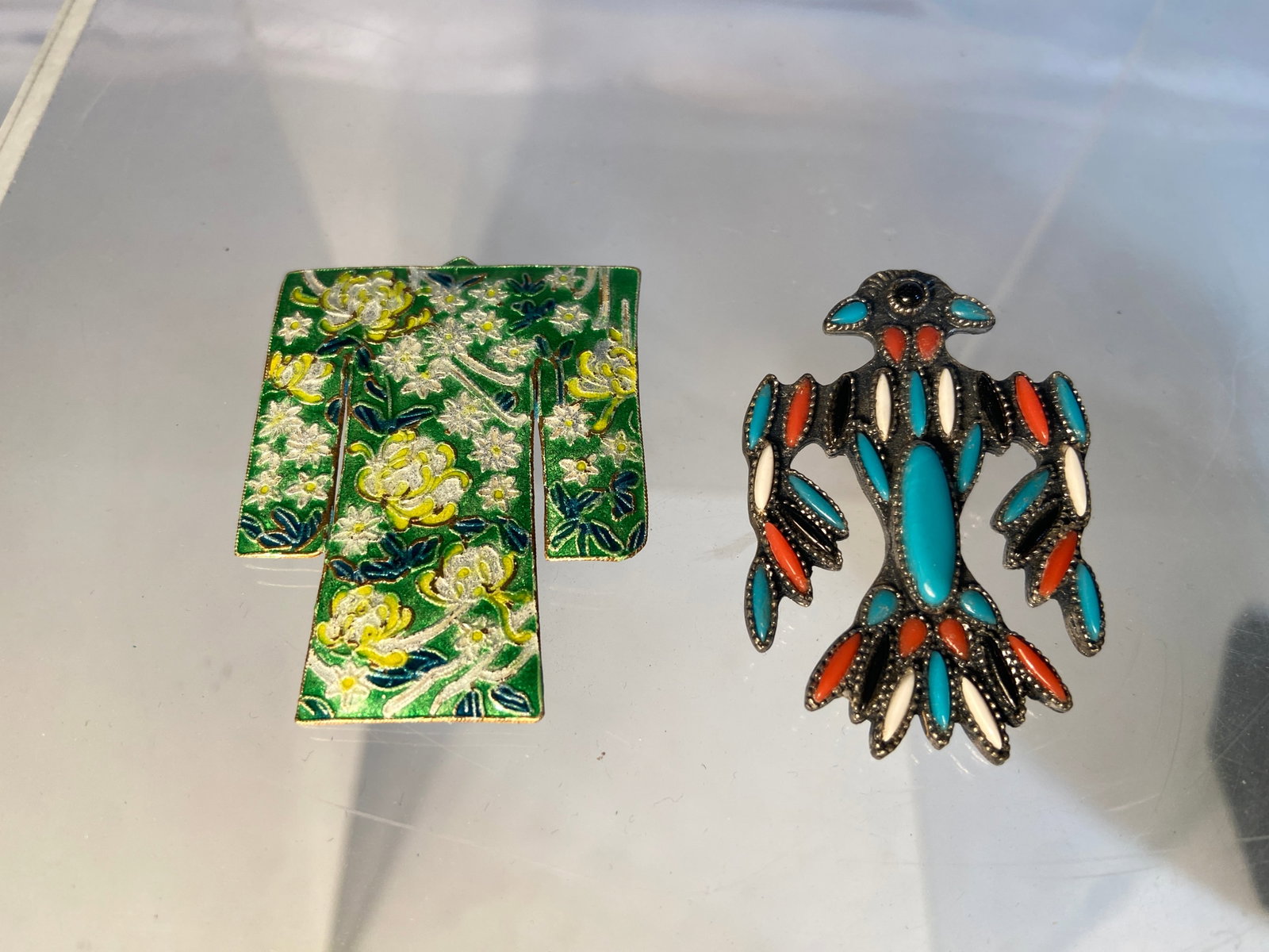 Two Vintage Brooches Including Cloisonné Kimono and Thunderbird Motif: Including a Japanese-style cloisonné enamel kimono-form brooch with floral decoration, together with a Native American style thunderbird brooch inset with turquoise-color, coral-color, black and whit