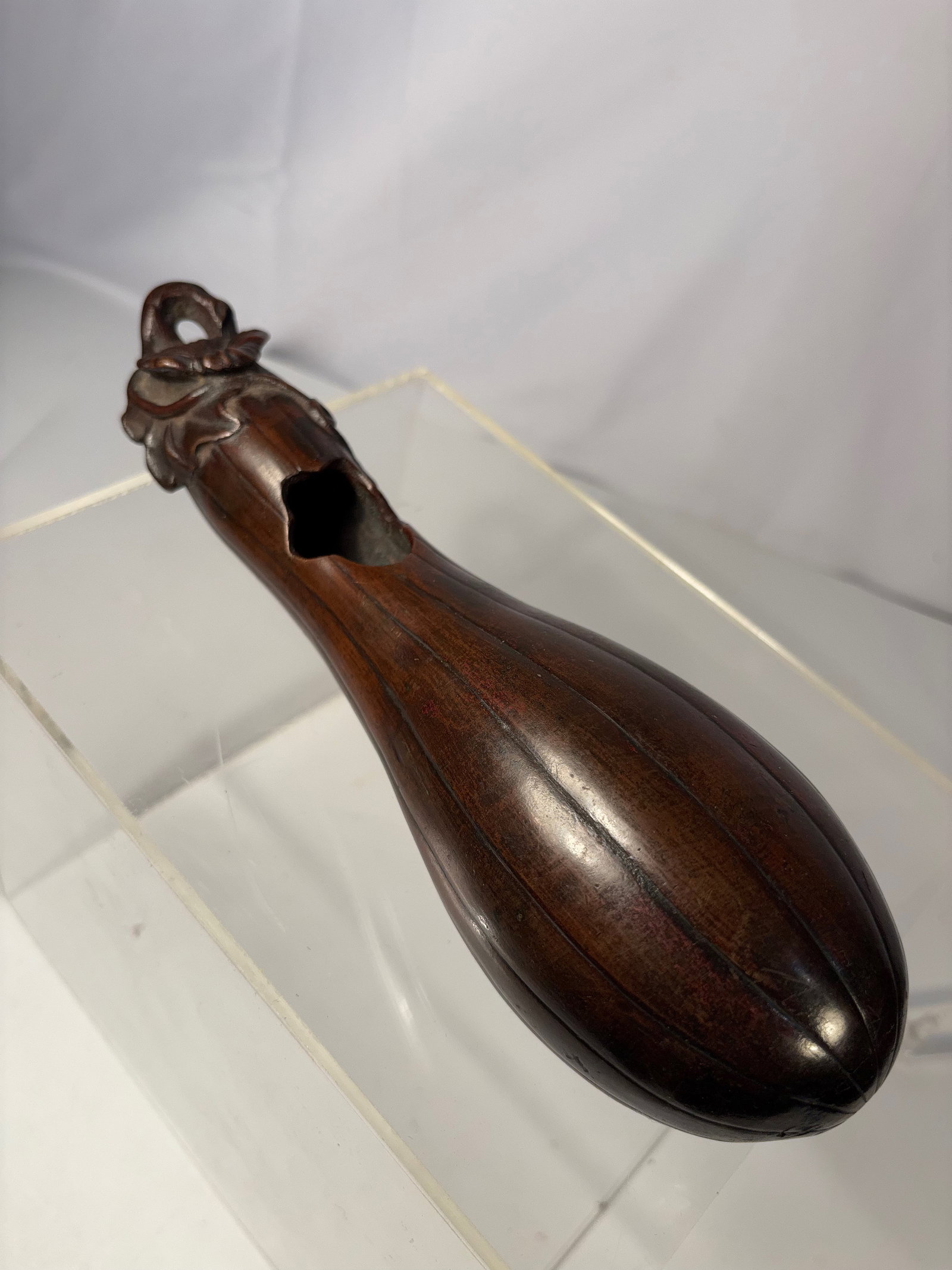A Japanese Bronze Incense Burner, Gourd Form, late Edo to Meiji period (19th century).: Japanese bronze incense burner cast in an elongated gourd form, the body smoothly finished with a dark brown patina. The upper section is surmounted by a sculptural knop incorporating a looped handle,