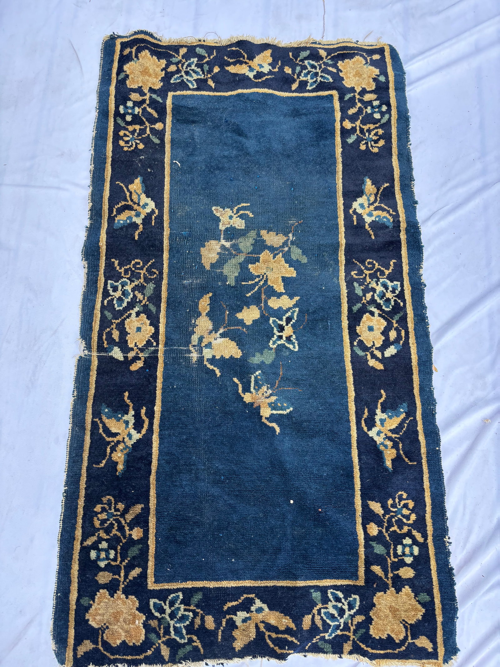 Antique Chinese Peking Butterfly & Floral Rug, 44 x 24 Inches: Hand-knotted Chinese Peking rug featuring butterflies among flowering vines on a rich cobalt blue field. Decorated with floral and butterfly motifs in ivory, gold, green, and blue tones. Measures appr