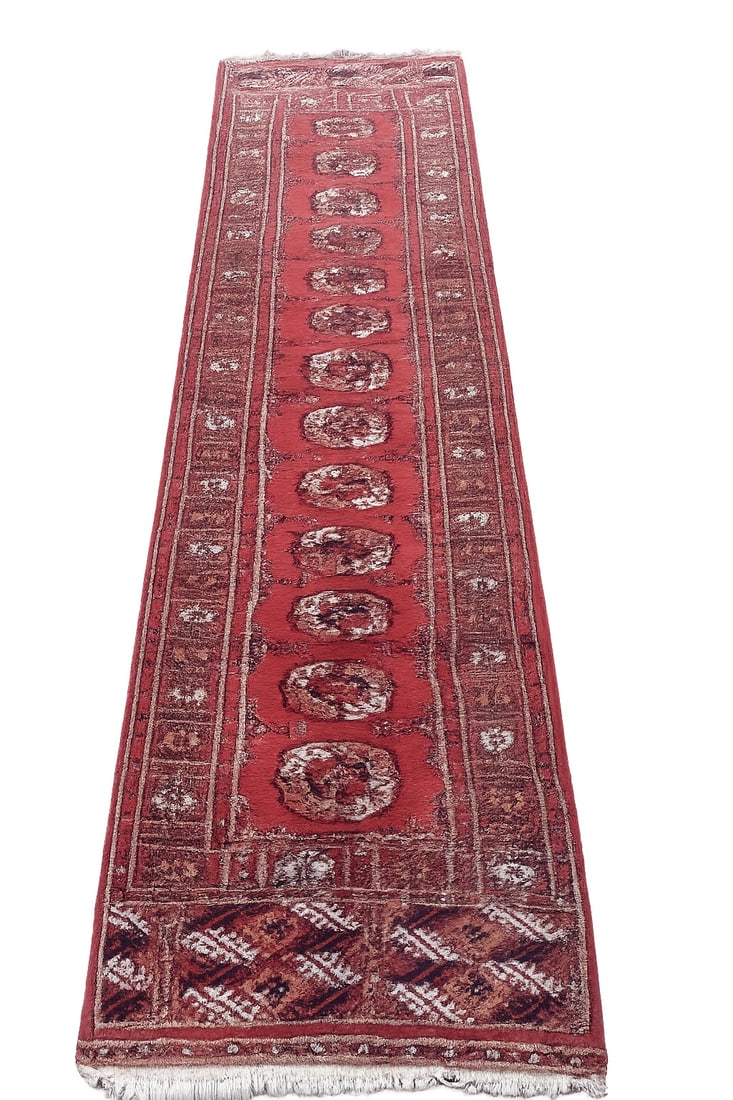 Vintage Turkmen Bokhara-Style Hand-Knotted Wool Runner Rug: A long runner rug featuring a traditional deep-red field decorated with repeating octagonal gul medallions, geometric borders, and patterned end panels. Likely Central Asian/Turkmen origin, hand-knott