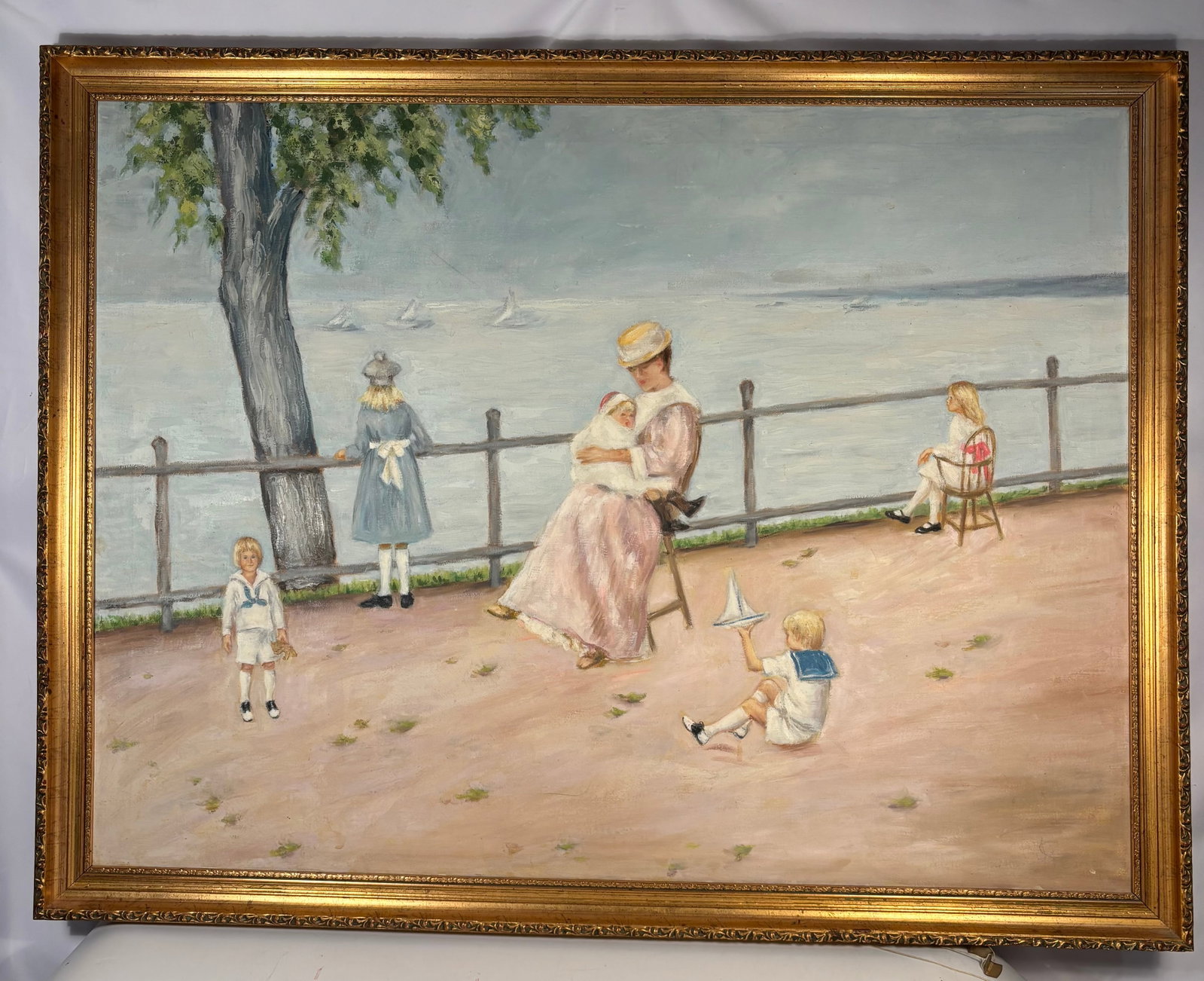 Josephine C. Pearson (American, St. Louis/Chicago) Lakeside Mother & Children Scene: An original impressionistic painting by Josephine C. Pearson, depicting a refined lakeside promenade with a seated mother and children overlooking sailboats on calm water. The reverse retains a handwr