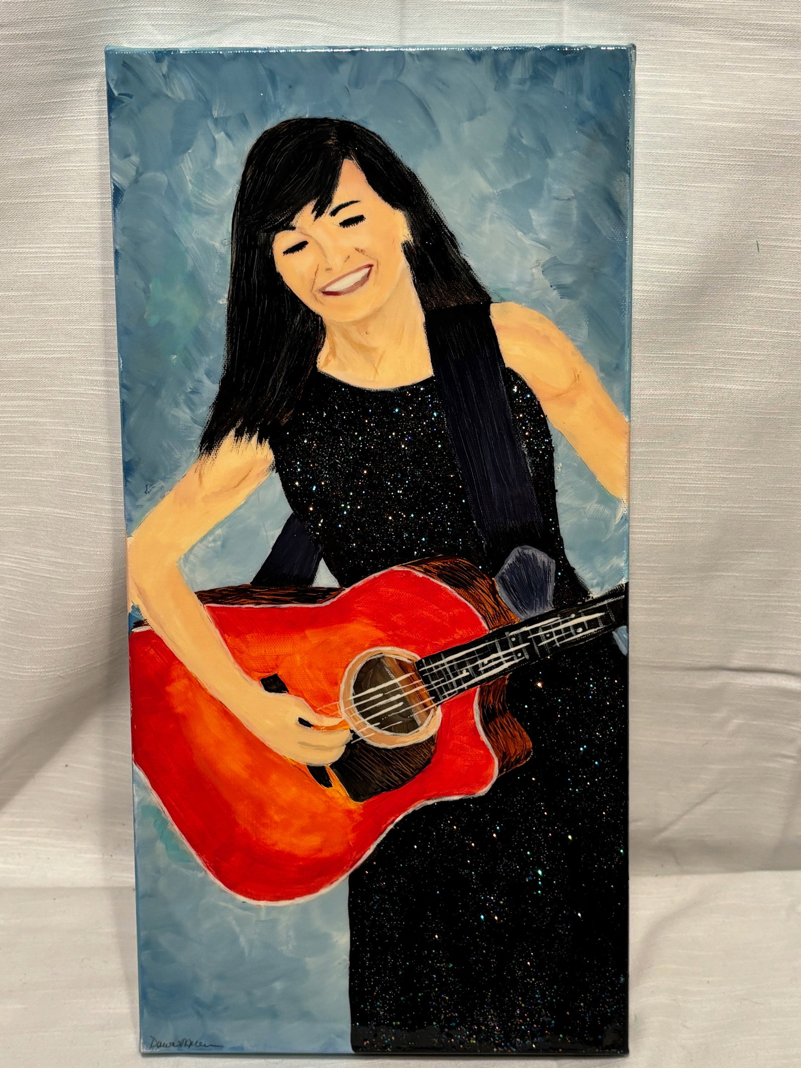 Decorative Mixed Media Painting, “ArtCrushed?? by Dawn Miller, Female Guitarist Scene: A contemporary portrait painting depicting a smiling woman holding a red acoustic guitar, executed in a bold and stylized manner. The figure is rendered with simplified forms and smooth color fields, 