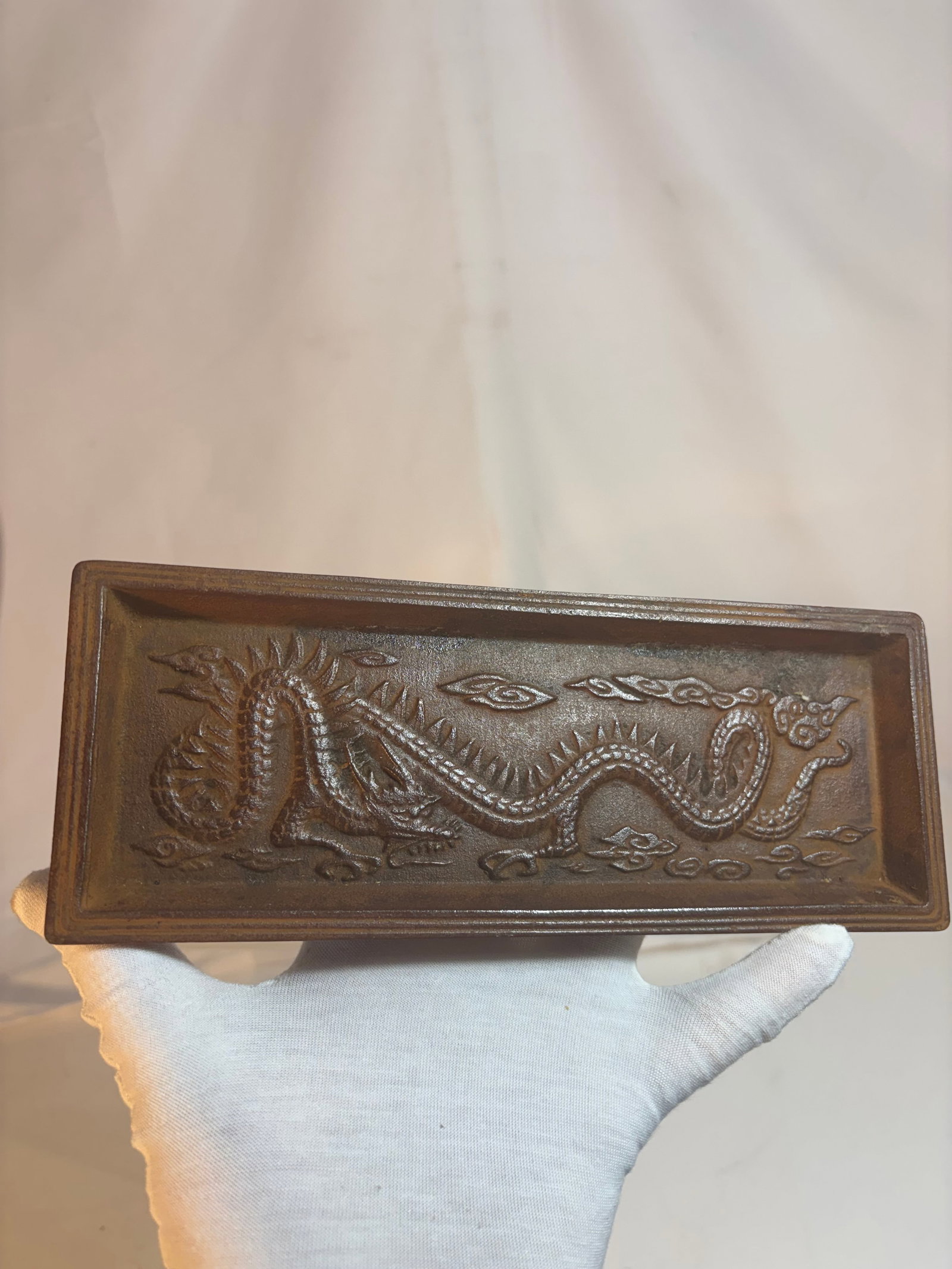 Japanese Cast Iron Dragon Decorative Tray / Incense Stand: Japanese cast iron rectangular tray or decorative stand featuring a high-relief dragon motif amidst stylized clouds. The dragon is rendered with elongated serpentine body, pronounced scales, and flame