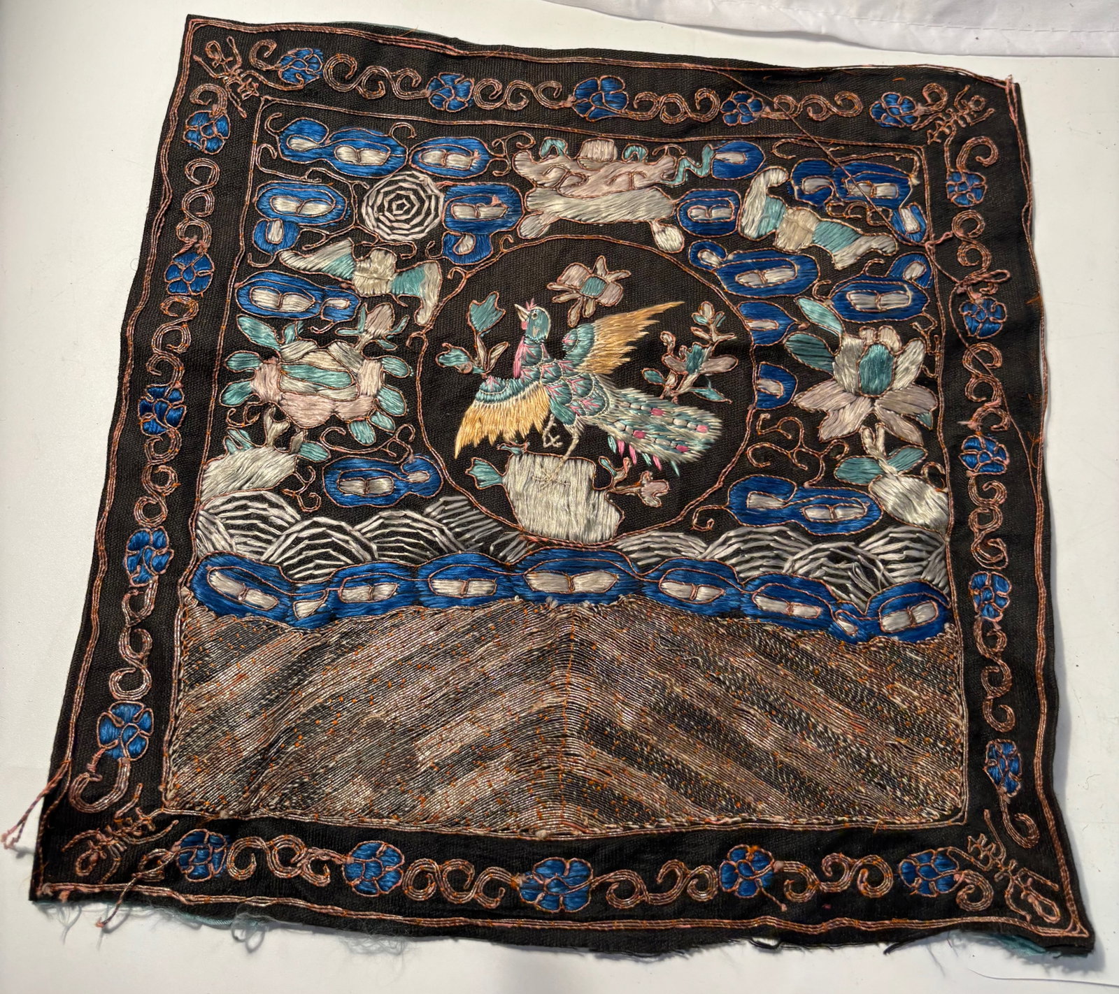A Chinese silk embroidered rank badge