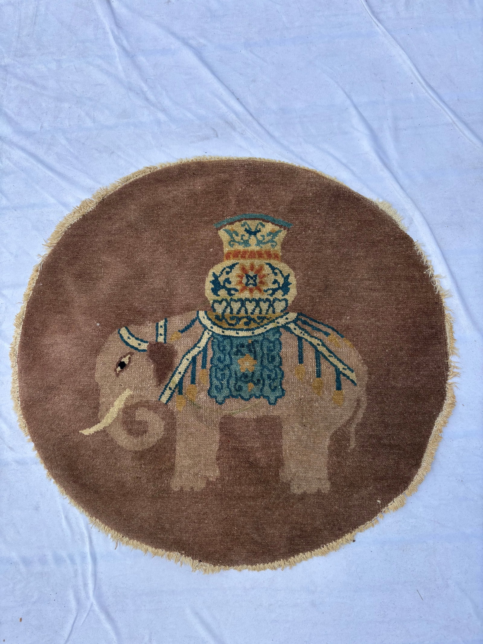 Antique Chinese Peking Rug Depicting Elephant Carrying Vase, 28 in. Diameter