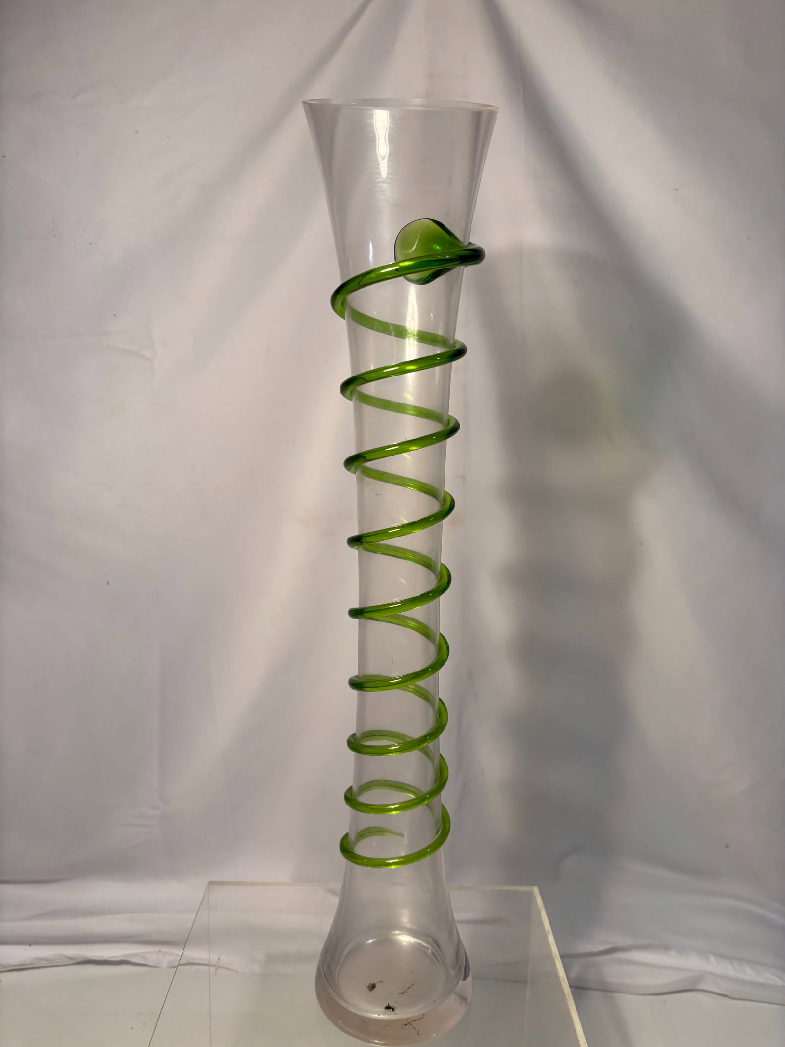 Hand-Blown Art Glass Vase with Green Spiral Decoration: Tall clear hand-blown glass vase of trumpet form with applied green spiral trailing decoration. Having a polished pontil underside and modern decorative design. Height: 19.5 in.