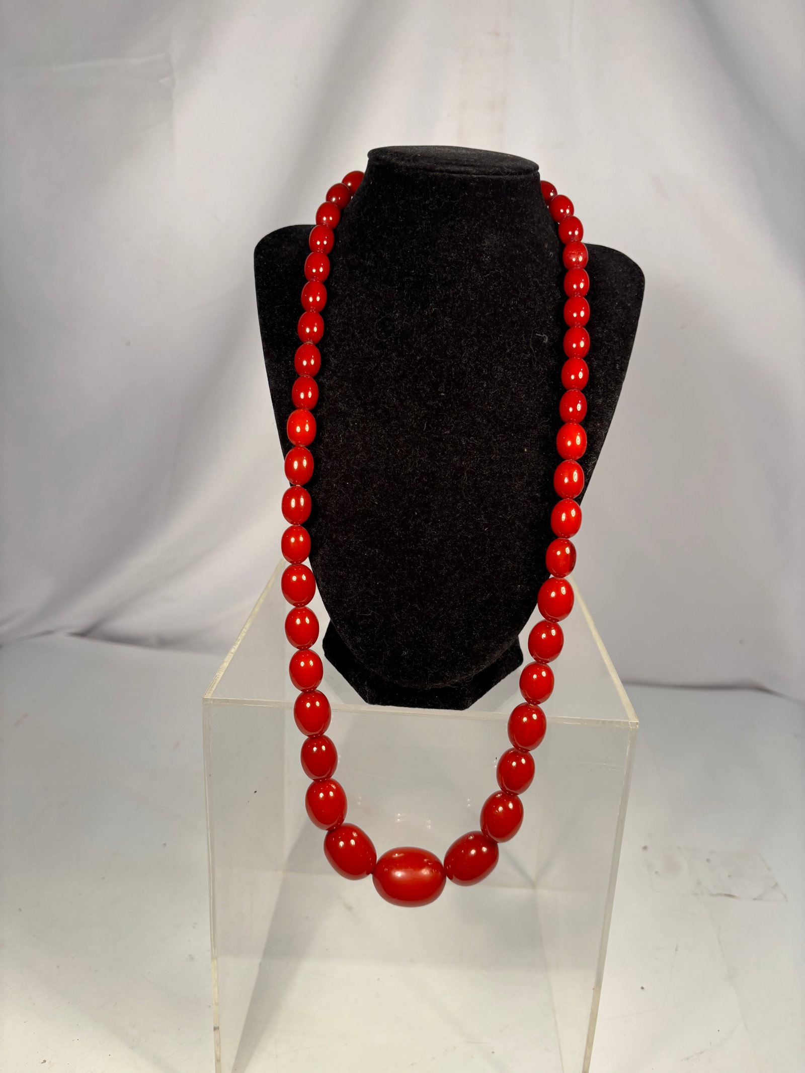 Vintage Graduated Red Bakelite Bead Necklace, 30 In., 92.7 g: Vintage graduated necklace composed of polished red Bakelite beads in round and barrel/oval forms. The beads have been Simichrome tested, indicating a positive reaction consistent with Bakelite. The n