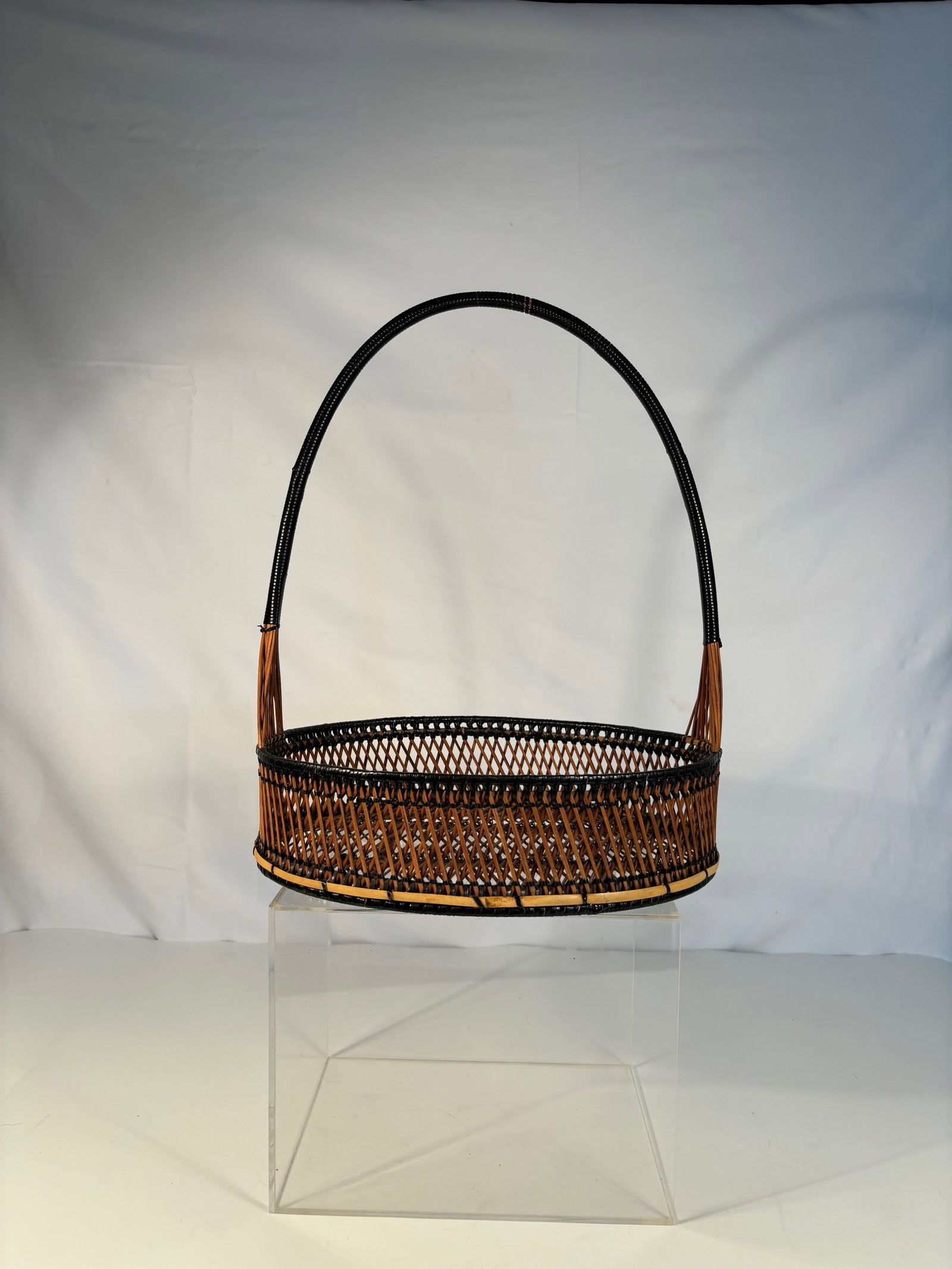 A Japanese Bamboo Ikebana Basket with Tall Handle