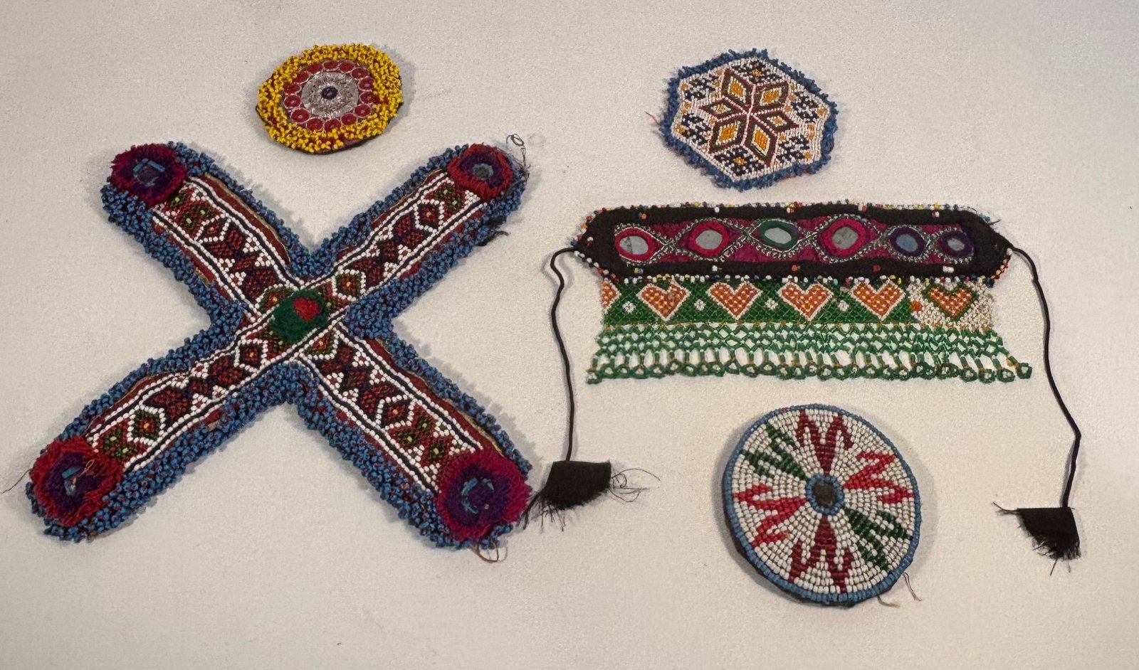 Set of 5 Vintage Afghan/Pakistani Kuchi Tribal Beaded Medallions: A group of five hand-beaded vintage tribal medallions from the Kuchi people of Northern Afghanistan or Pakistan, Each medallion is meticulously crafted with colorful glass seed beads in vibrant geomet