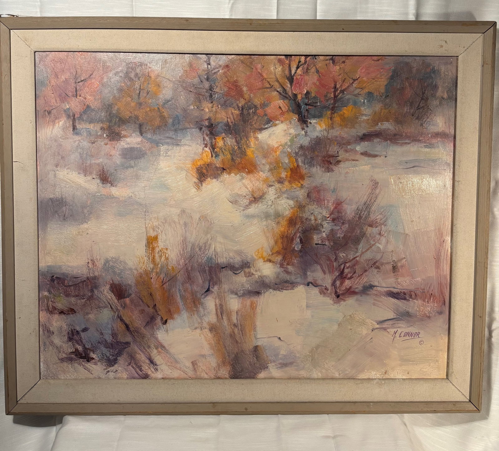 Mae Connor Signed Winter Landscape Painting: Beautiful signed winter landscape by Chicago artist Mae Connor, depicting a snow-covered woodland scene rendered in soft impressionistic brushwork.The composition features muted lavender, cream, gray,