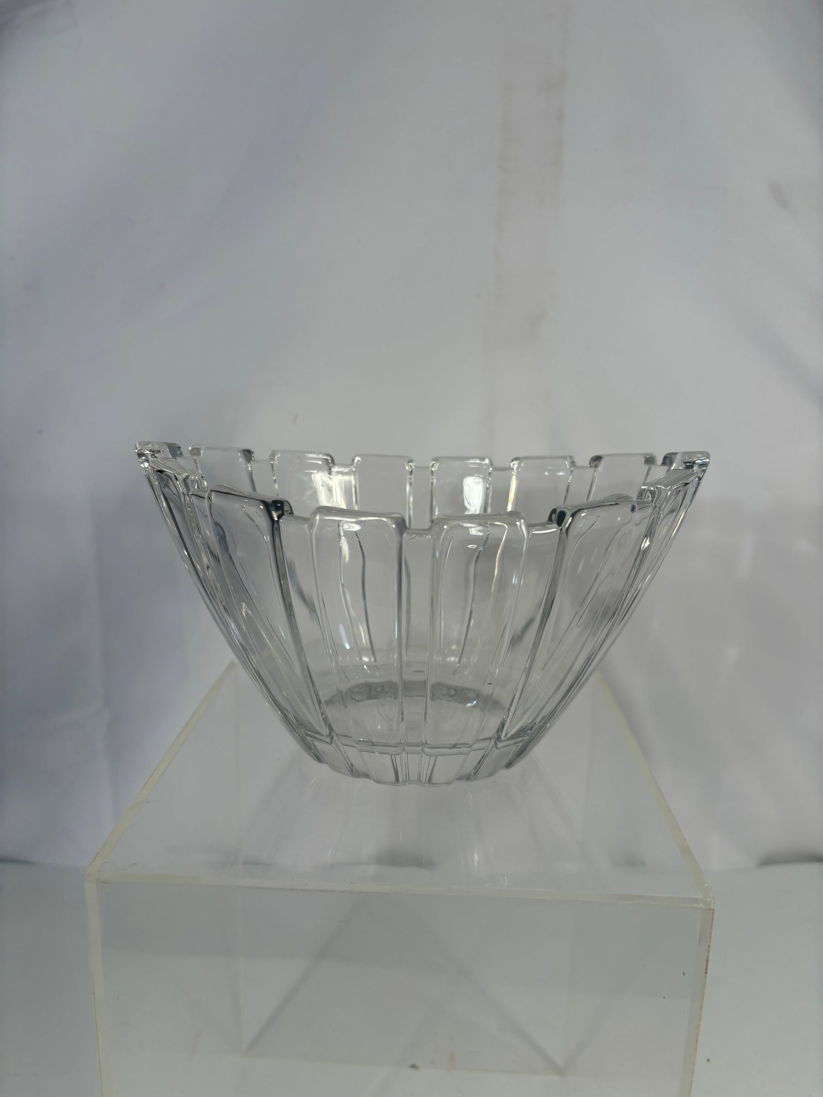 A Waterford Crystal Commemorative Presentation Bowl, August 6 2005: A fine Waterford crystal presentation bowl, featuring sharply cut vertical wedge panels and a sculptural scalloped rim. The underside bears an engraved presentation inscription reading “August 6, 20