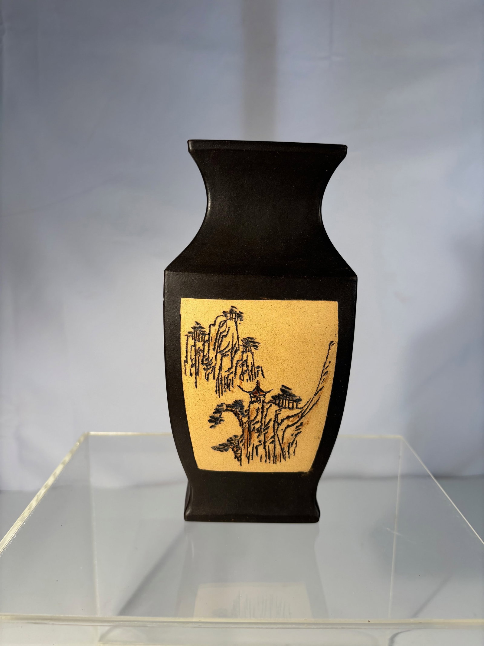 A Chinese Yixing Zisha Square Vase with Xiao Shi Ke Mark: 20th century; A Yixing zisha square vase, the sides with ochre panels decorated in the shike technique. One side with an incised calligraphic inscription in running script, the reverse with a mountain