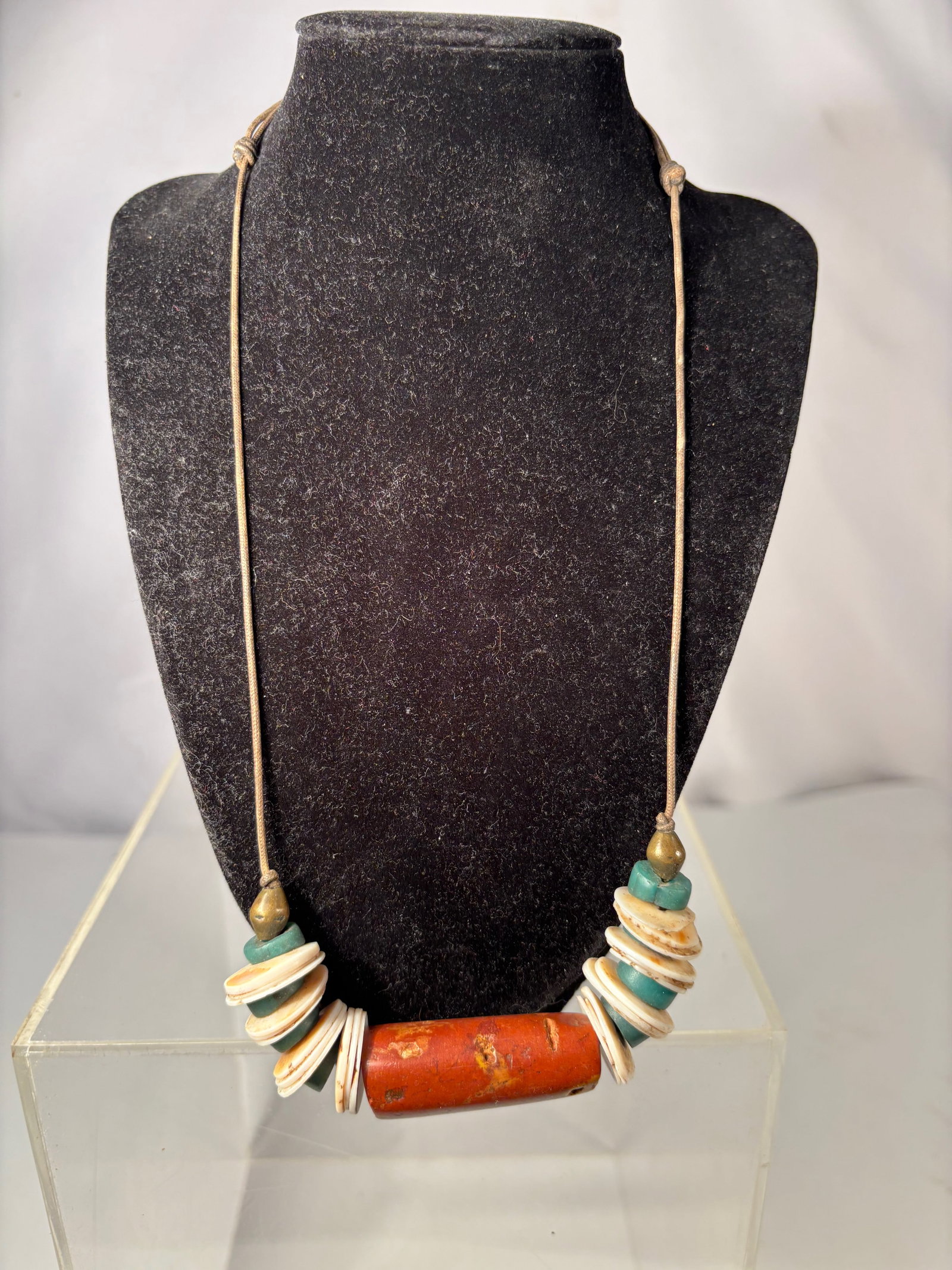 Ethnographic Necklace w/ Antique Bead Style Coral Tube, Shell Discs: Vintage ethnographic-style necklace featuring a central coral tube bead with surface wear and pitting, giving the appearance of an antique trade bead. The centerpiece is flanked by stacked shell disc 