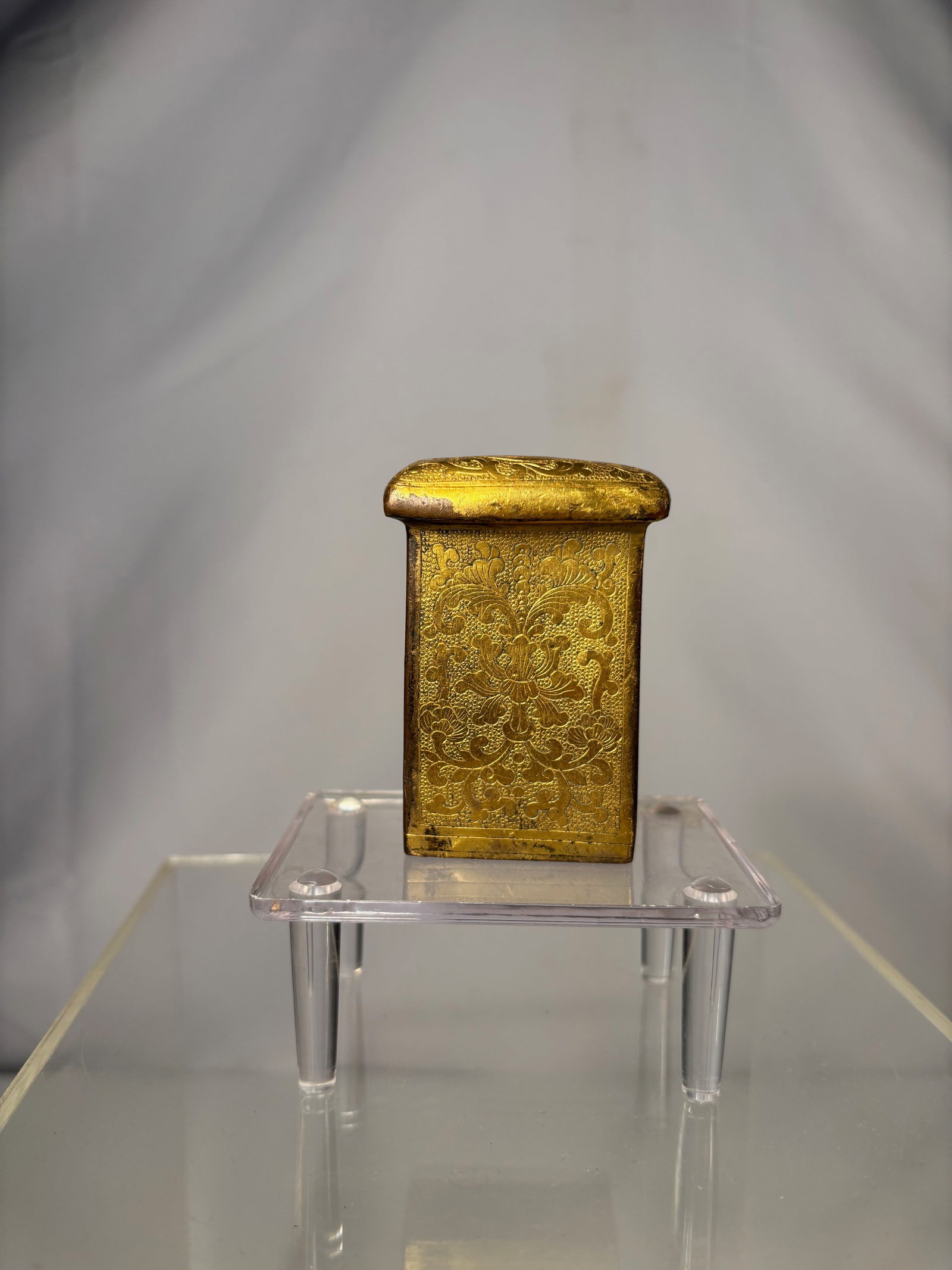 A Chinese Gilt Bronze Rectangular Fitting with Shou Medallion