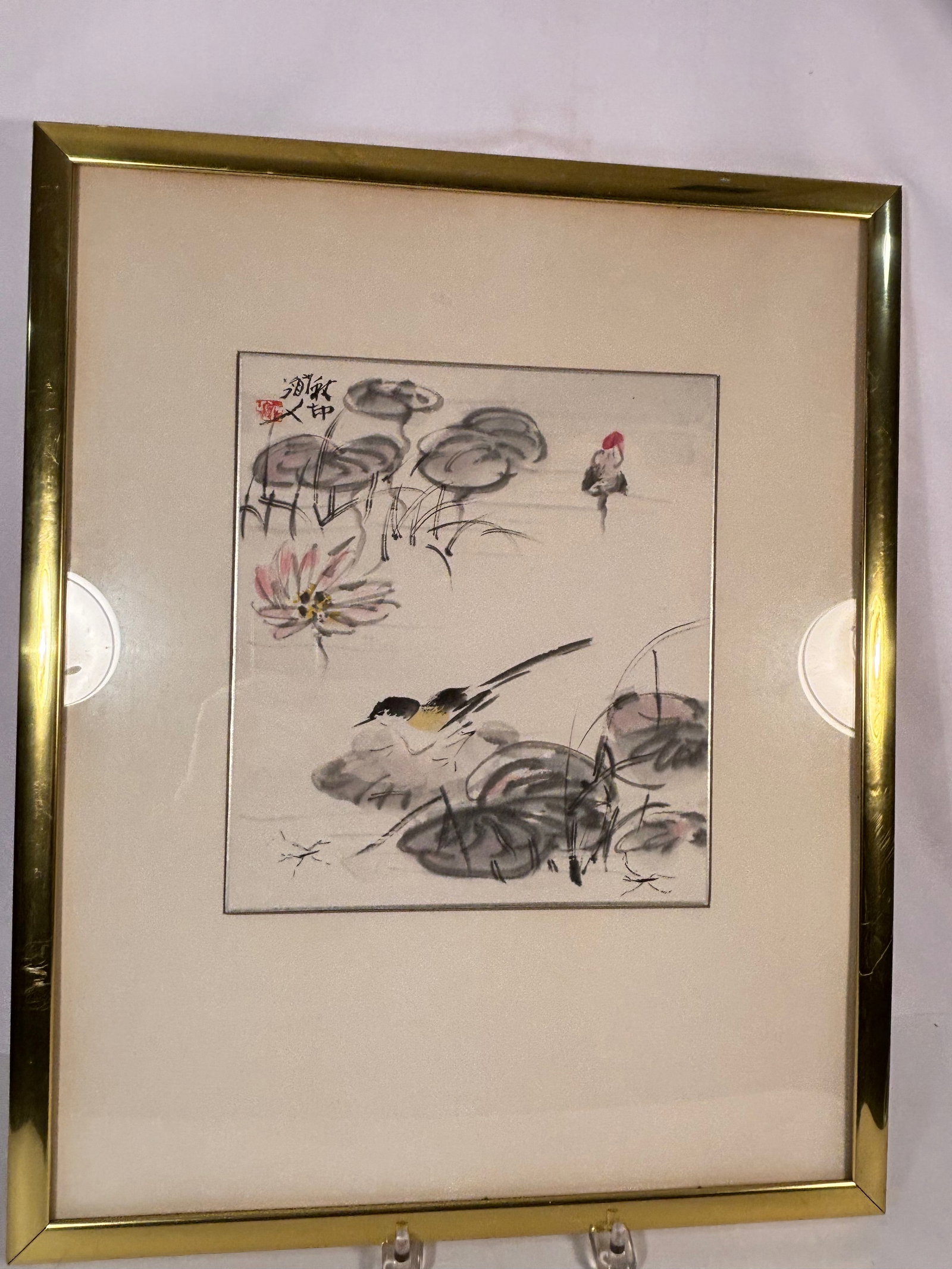 Framed Chinese Water-Ink Painting of Lotus Pond with Birds, Signed: 20th century; A fine Chinese ink and wash painting depicting a tranquil lotus pond with blooming lotus flowers, broad ink-wash leaves, and a pair of delicate waterbirds. Executed with soft brushwork a