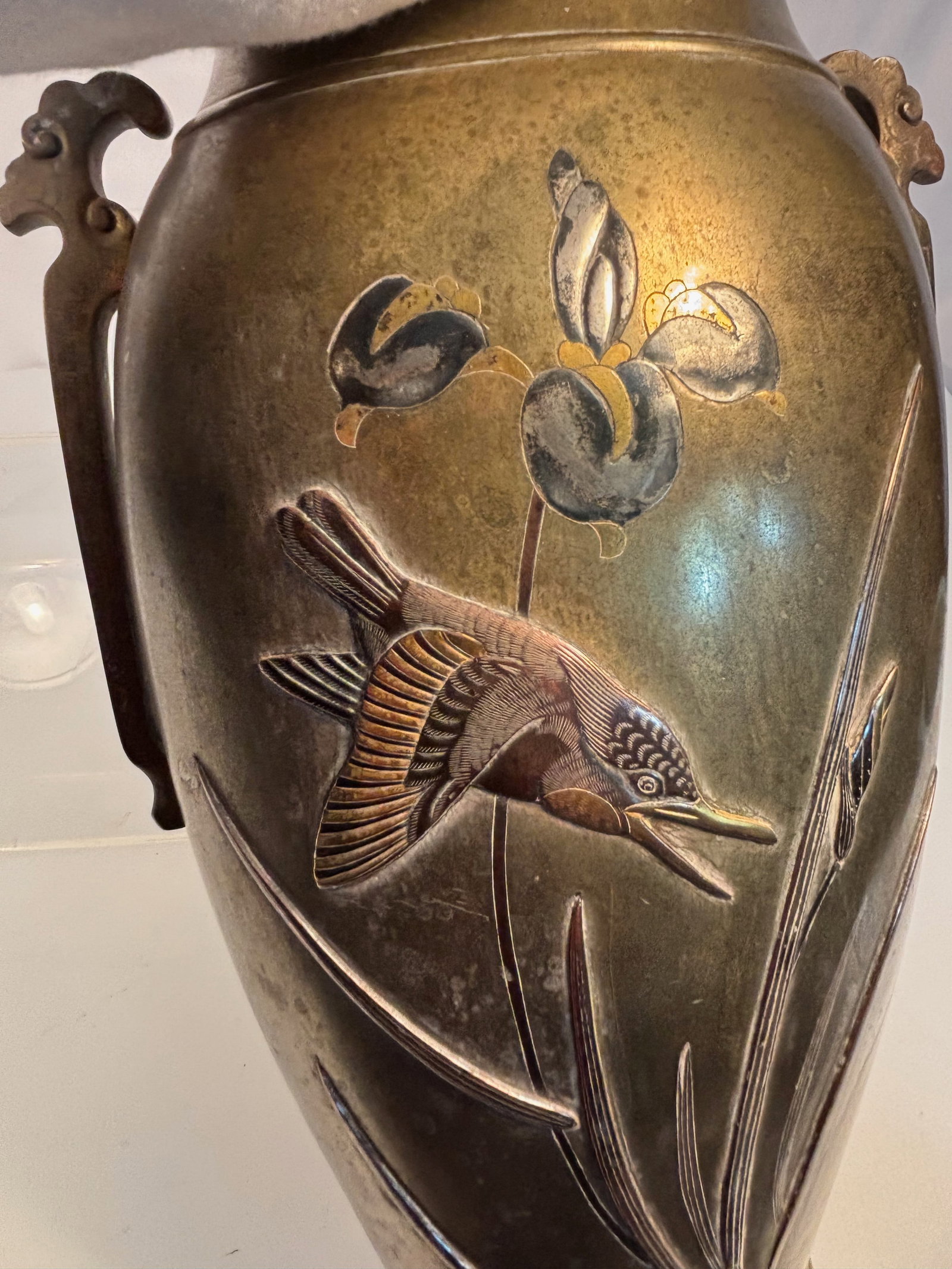 A Japanese Mixed-Metal Bronze Vase with Birds and Flowers , Meiji Period: A Japanese Meiji period (1868–1912) bronze vase, finely decorated in mixed metals with inlaid birds, flowers, and foliage in silver, gilt, and shakud?. The baluster form features twin stylized drago