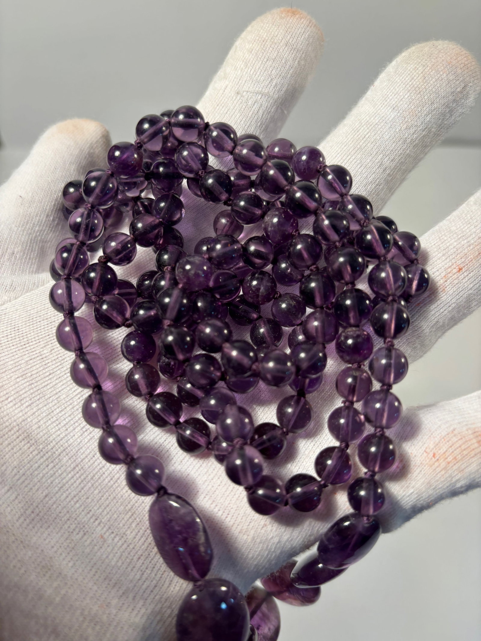 A super long 60" well-polished amethyst beads necklace