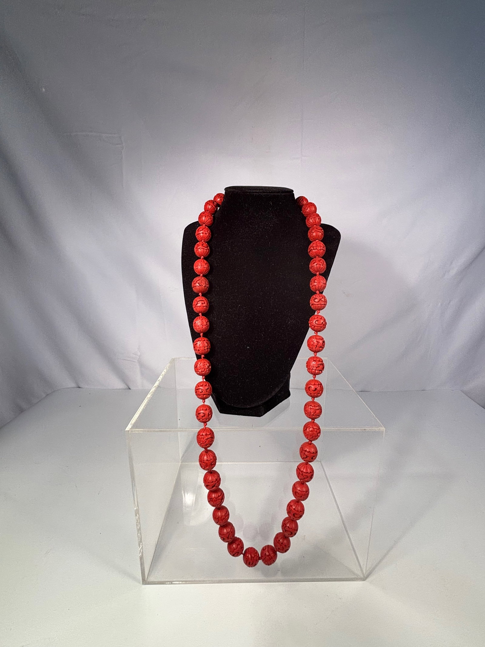 A Chinese Carved Cinnabar Lacquer Bead Necklace