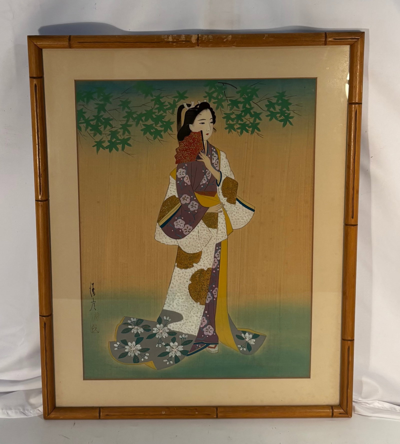 Japanese Bijin Hanging Scroll, Bearing the Signature “J?hiko?? (??): A finely executed Japanese hanging scroll depicting an elegant bijin (beautiful woman) standing beneath cascading maple branches. The figure is portrayed wearing an elaborate kimono decorated with flo