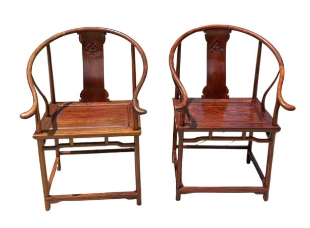 A pair of Chinese hardwood Horseshoe back armchairs(QUANYI), Ming style: A finely crafted pair of Chinese horseshoe-back armchairs (quanyi), made in the elegant Ming dynasty style. Each chair features a continuous rounded crest rail that flows seamlessly into the arms, sup