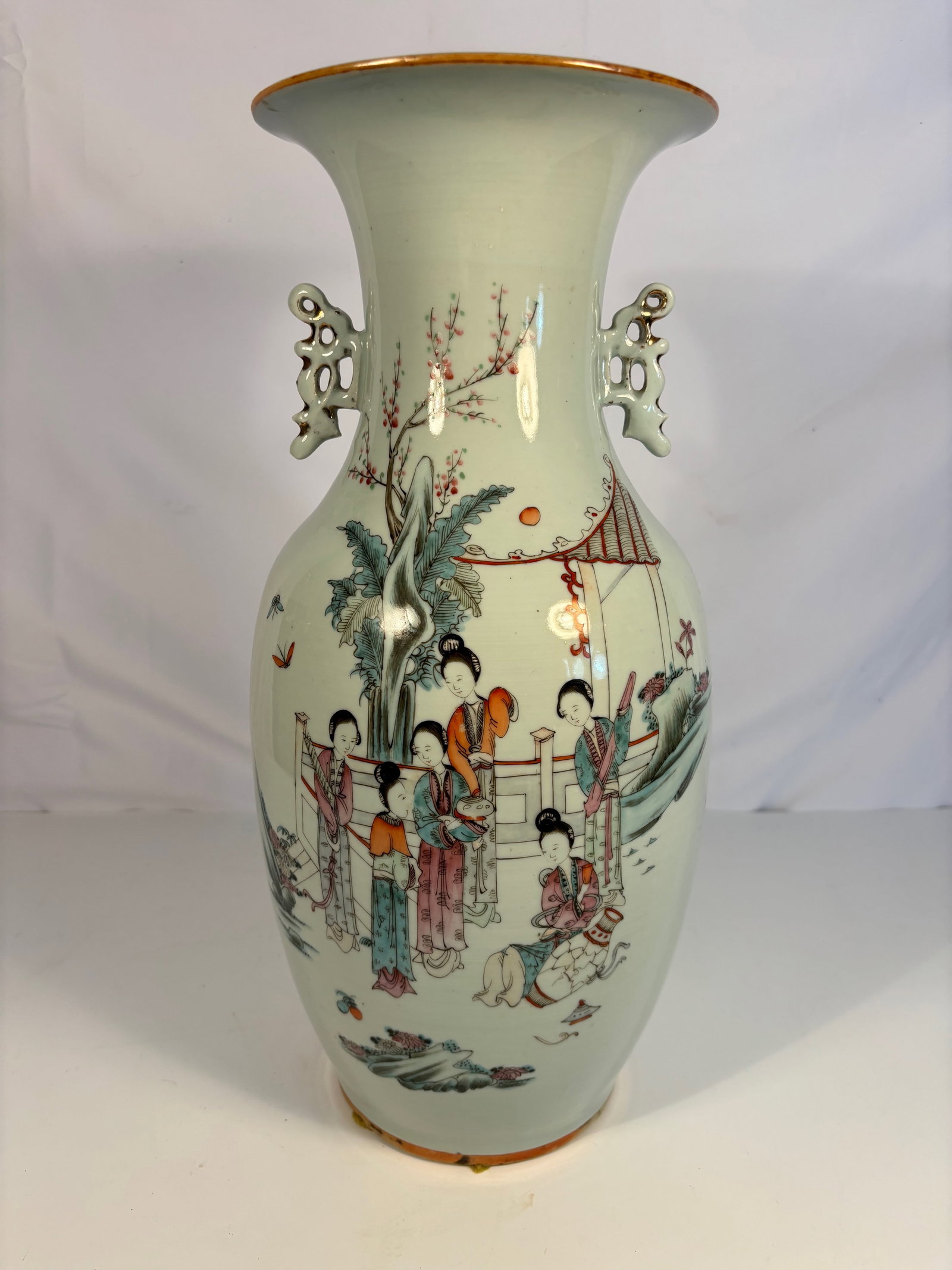 A Chinese Famille Rose Vase with Figures and Poetic Inscription: 19th century to early 20th century, A Chinese porcelain baluster vase finely enameled in famille rose enamels, depicting a group of court ladies in a garden landscape beneath blossoming branches. The 