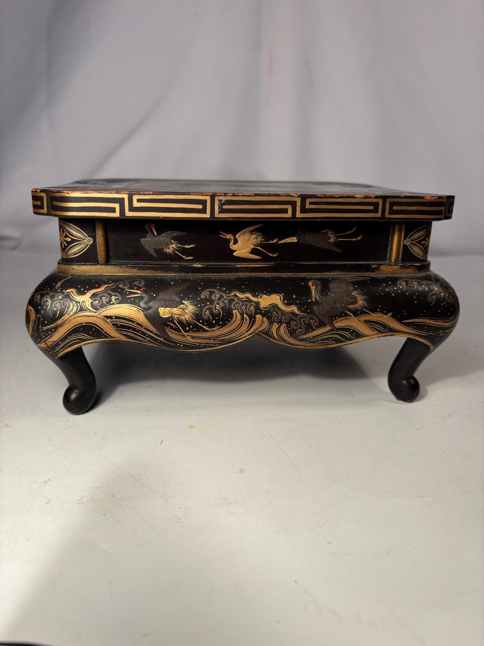 Vintage Japanese Black Lacquer Miniature Display Stand, Crane & Wave Motif: This exquisite vintage Japanese black lacquer miniature display stand (Kaidai) is an exceptional tabletop accent, meticulously scaled at 8 by 6.5 inches with a height of 4.25 inches. Ideal for