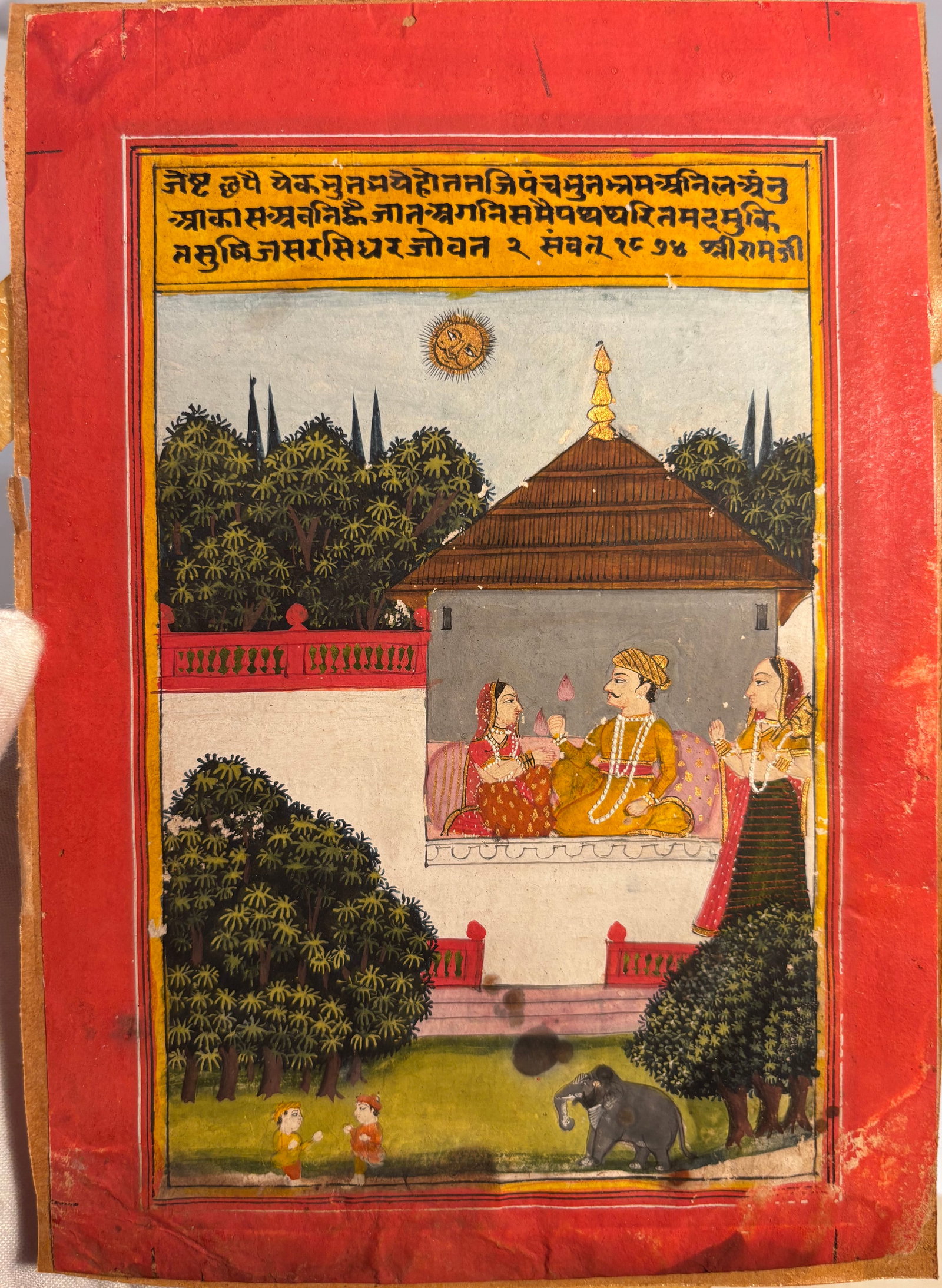 An Indian Miniature Painting of a Royal Couple in a Pavilion: The Month of Jeth (Jyeshtha) from a: An exquisite illustration from a Barahmasa (Twelve Months) series, this Indian miniature painting depicts a royal couple conversing intimately within a cool white pavilion during the scorching summer 