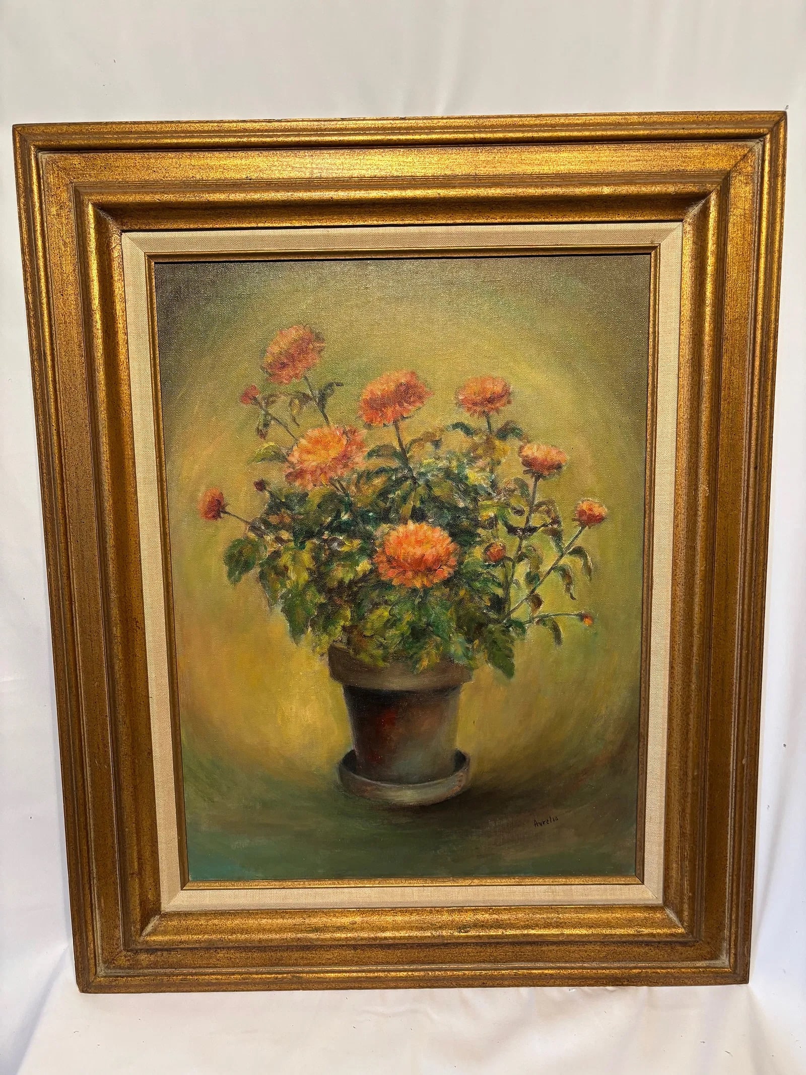 Aurelia Huzur “Mums?? Floral Acrylic Painting: Acrylic on canvas depicting a vibrant arrangement of blooming chrysanthemums in a flowerpot. Executed in a soft impressionistic style with warm peach, orange, and pink blossoms set against a muted gre